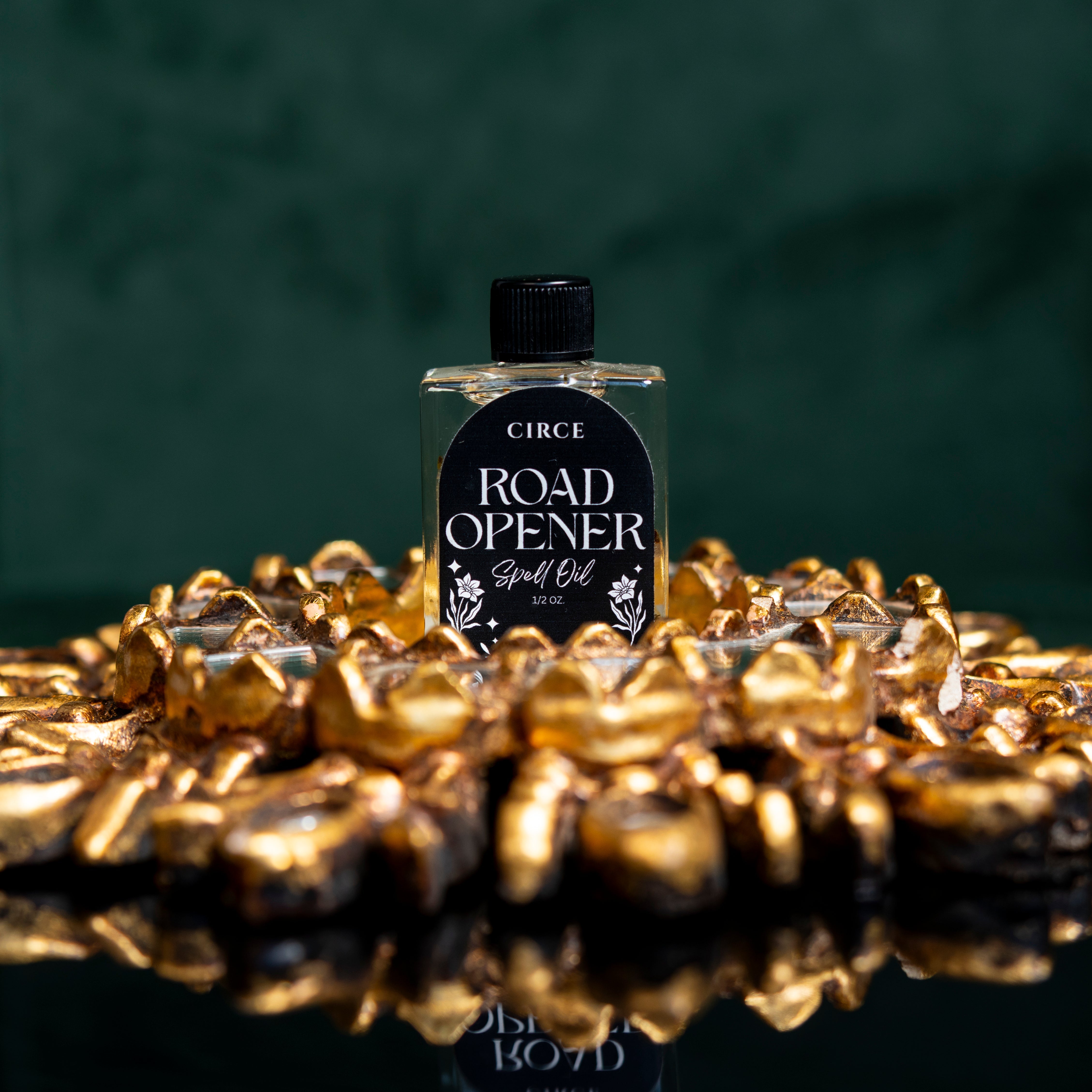 Circe Boutique Road Opener Ritual Oil bottle with a dark glass container and decorative label, used for removing obstacles and opening paths.