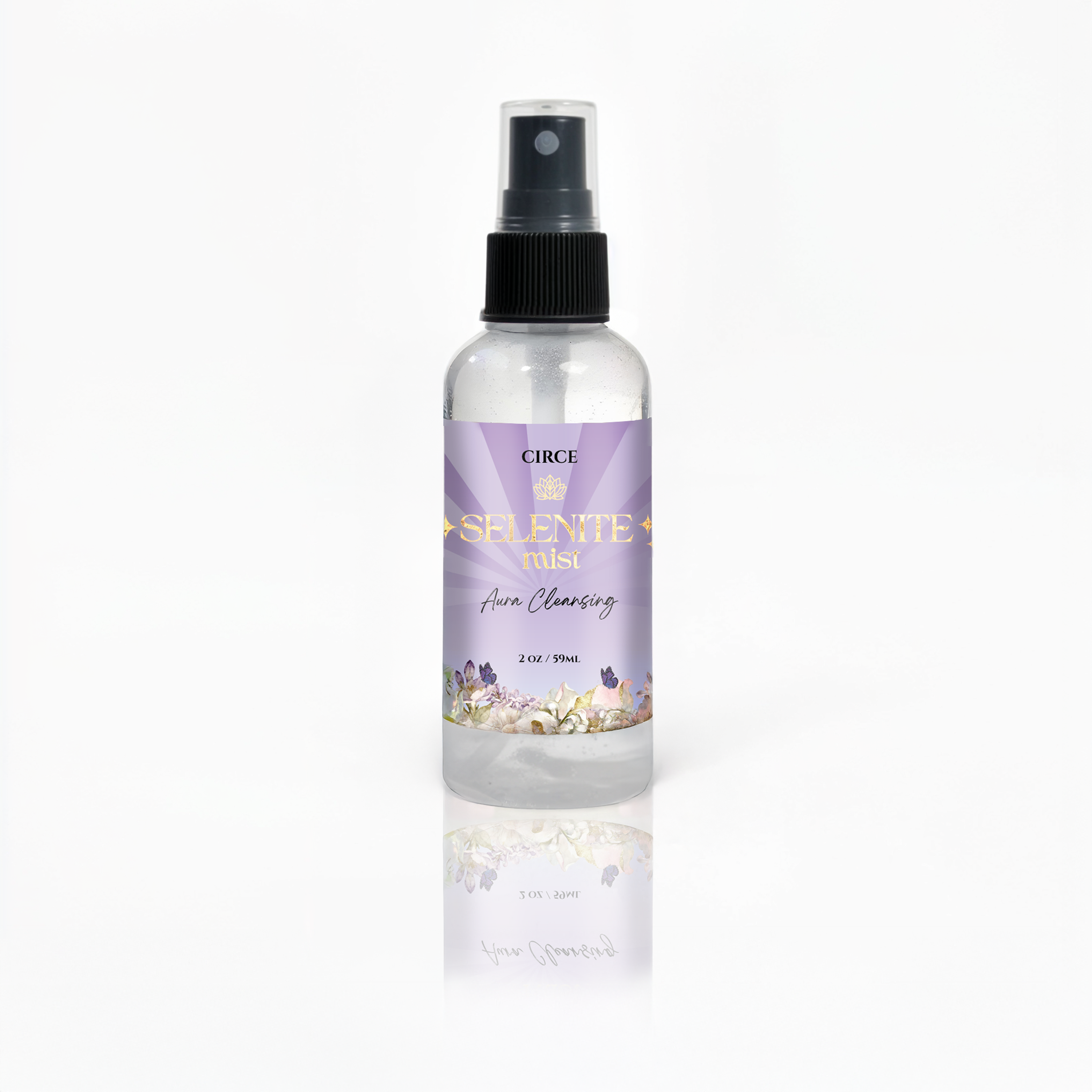 Selenite Aura Cleansing Mist spray bottle from Circe Boutique with white tea and ginger scent, used for energy clearing and aura cleansing.