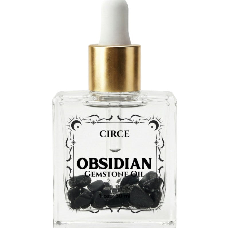 Protection Body Oil with obsidian crystal from Circe Boutique, showcasing a dark, luxurious ritual oil in a glass bottle.