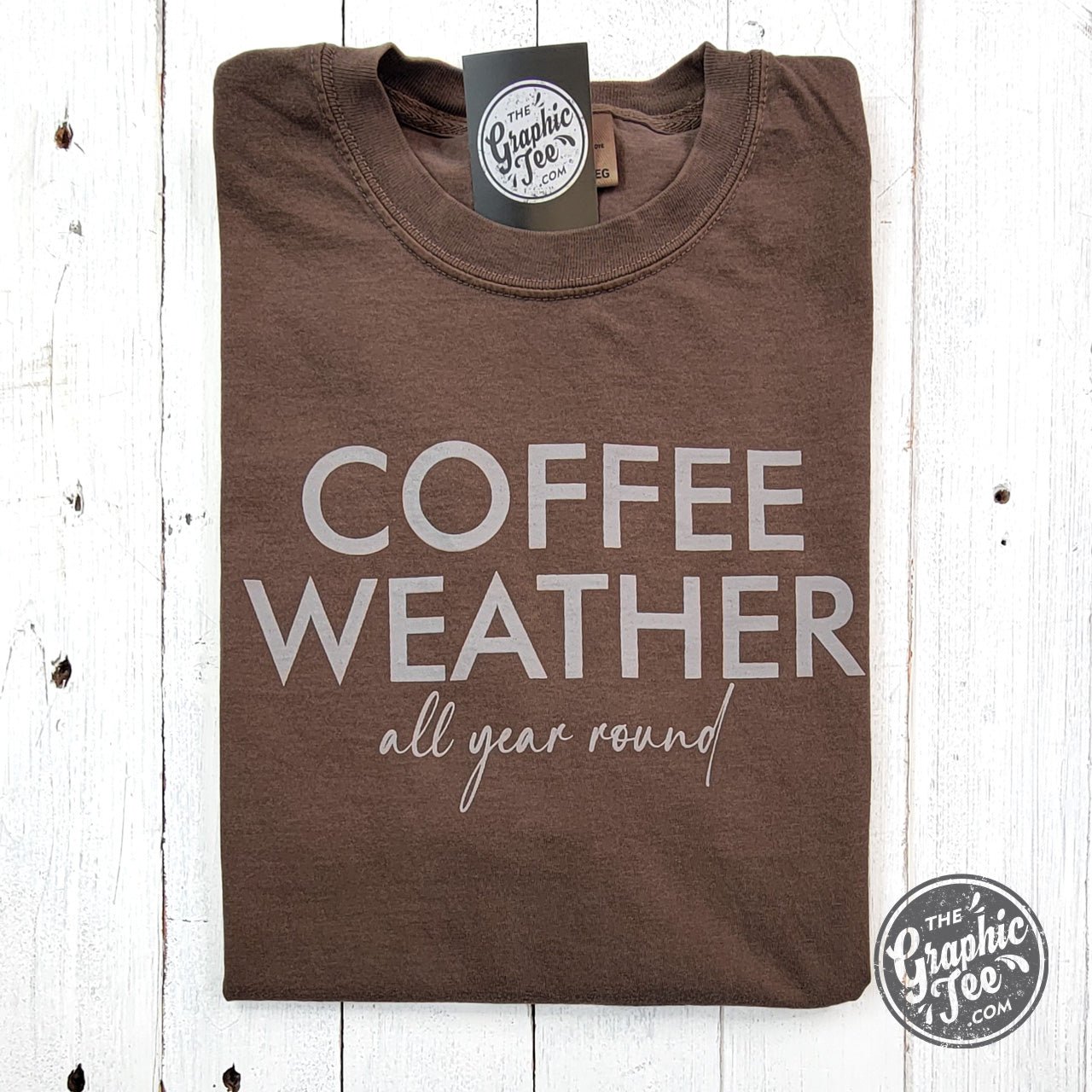 The Graphic Tee Coffee Weather All Year Round pigment-dyed SS graphic t-shirt with coffee-themed design on front.