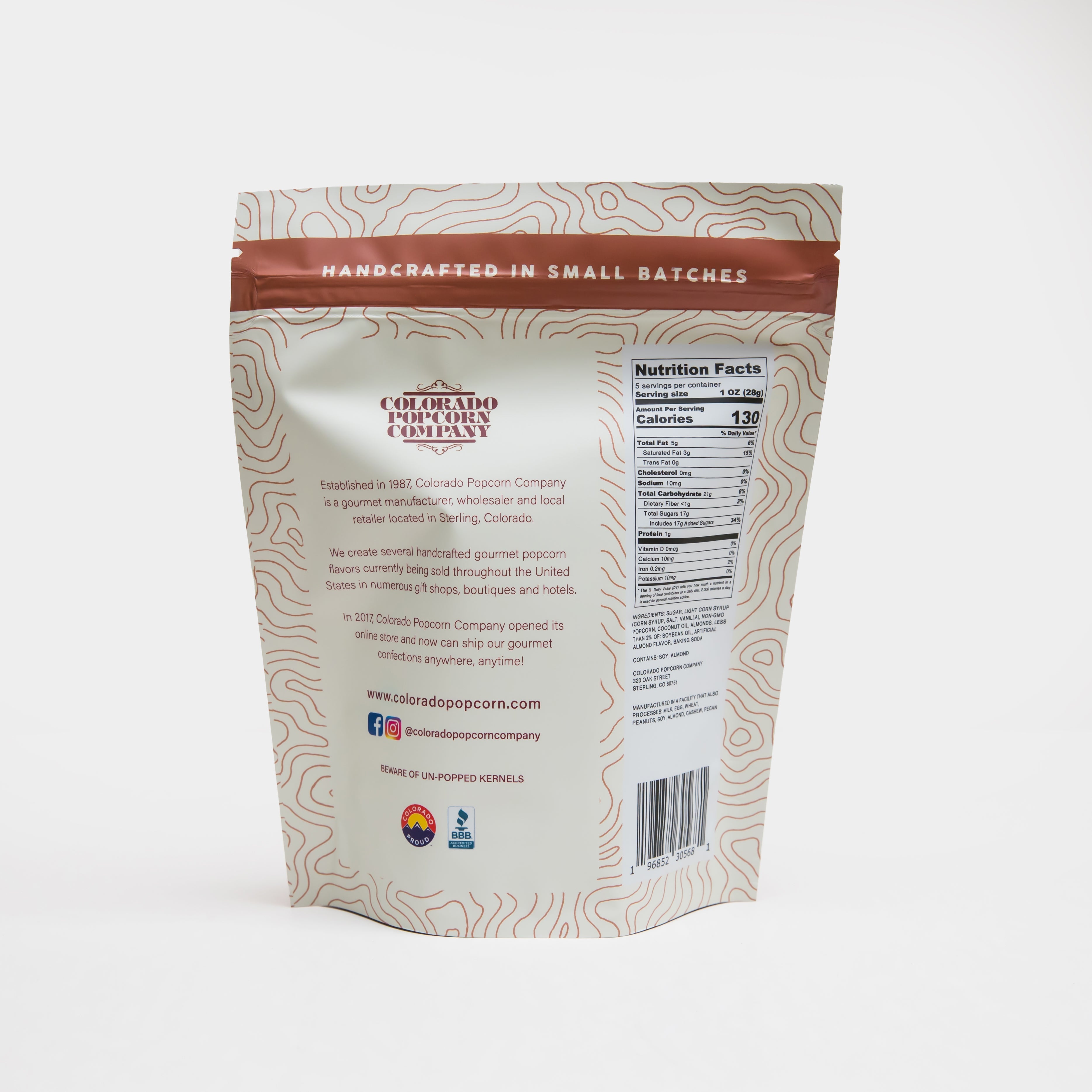 Amaretto flavored popcorn by Colorado Popcorn Company in a 5 oz bag, showcasing glossy, caramelized popcorn with a rich amaretto glaze.