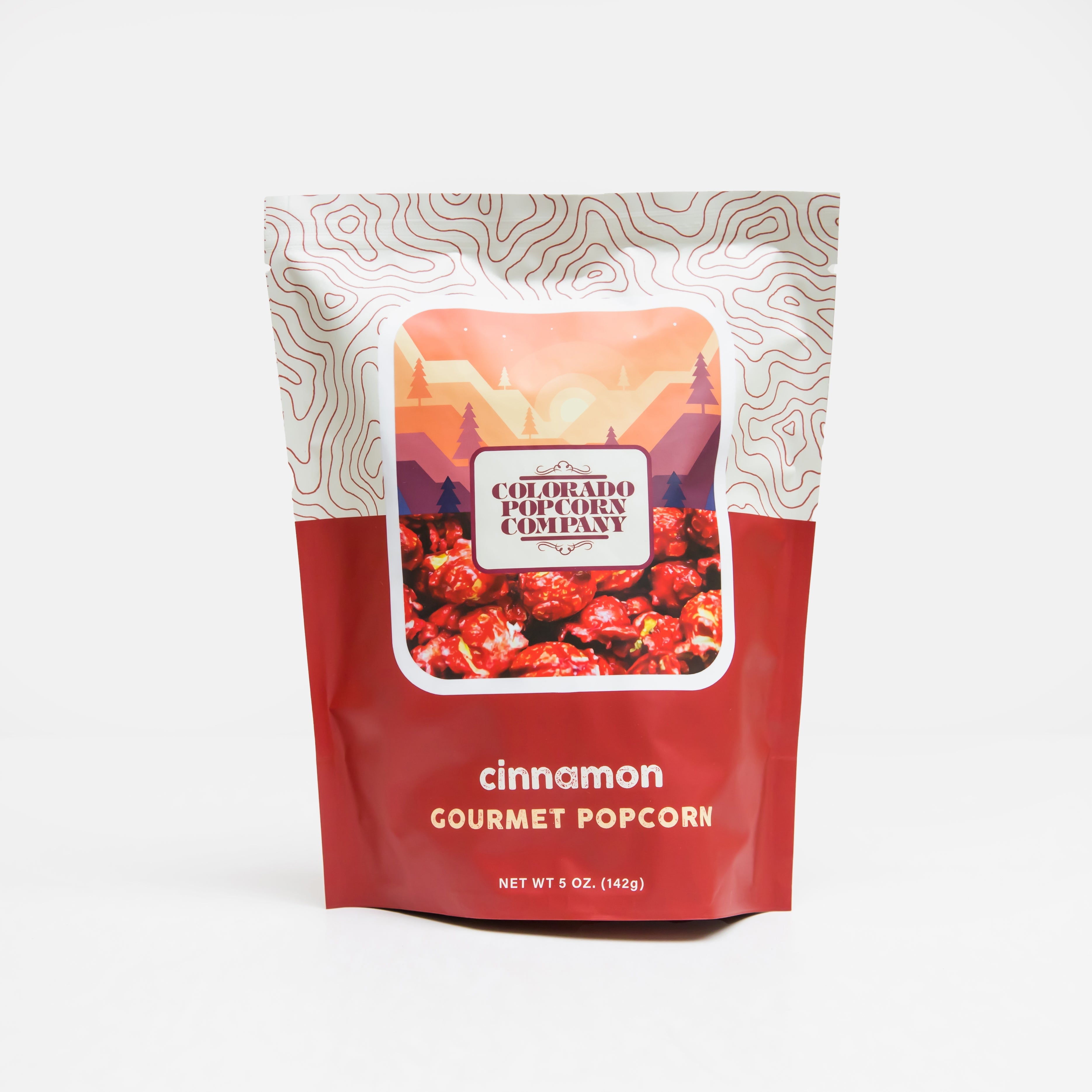 Sweet cinnamon popcorn from Colorado Popcorn Company in a 5 oz bag, featuring golden popcorn coated with cinnamon flavor.