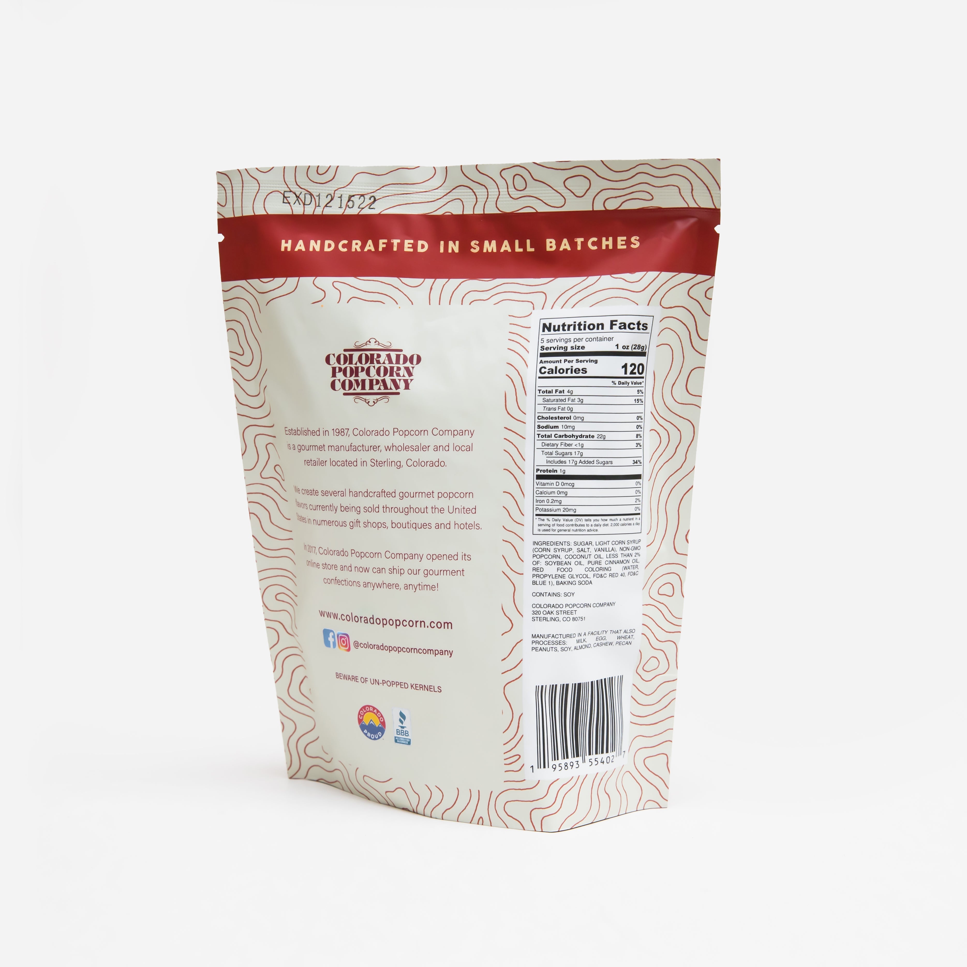 Cinnamon popcorn in a clear bag from Colorado Popcorn Company, 5-ounce net weight, with cinnamon-coated kernels visible.
