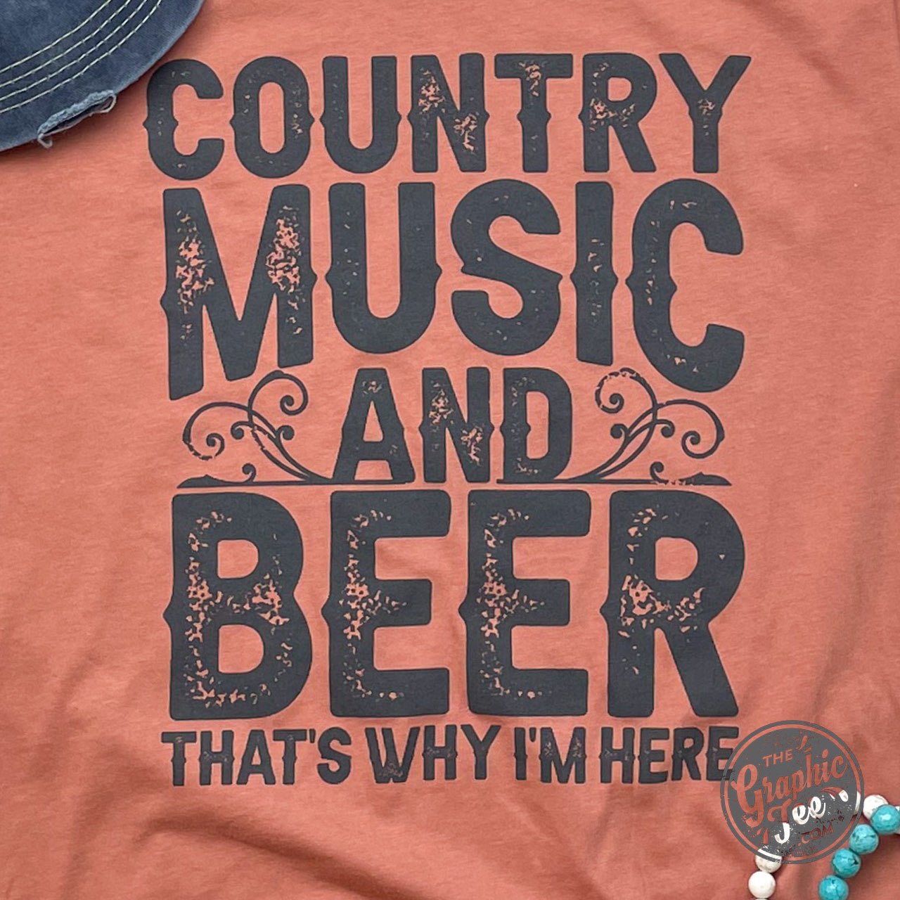Country music and beer graphic short sleeve tee by The Graphic Tee, featuring a casual design with country music and beer motifs.