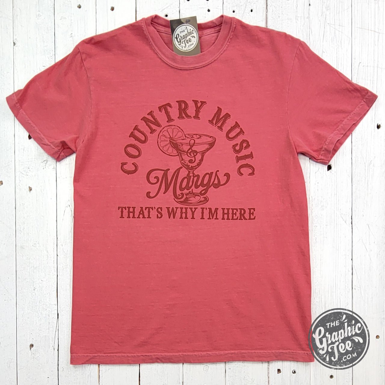Country music and Margs watermelon graphic short sleeve tee from The Graphic Tee, featuring colorful country and watermelon design.
