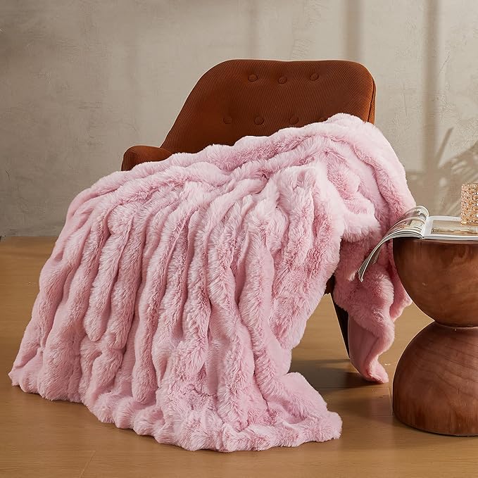 Pink faux fur throw blanket by CozyNest Decor, fuzzy plush, cozy and thick king size bed blanket for warmth and comfort.