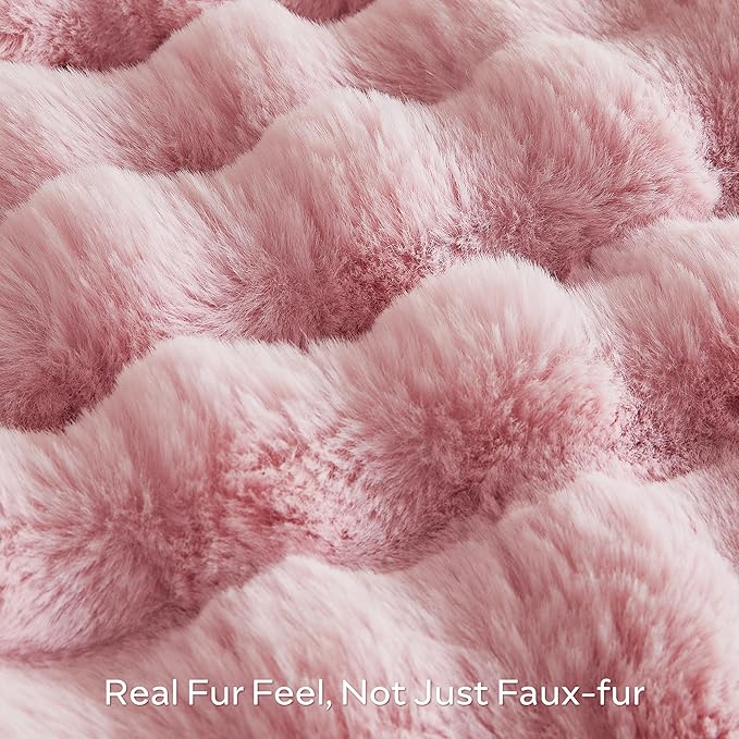 Pink fuzzy faux fur throw blanket by CozyNest Decor, cozy plush king-size bed blanket with thick, warm, and soft bubble texture.