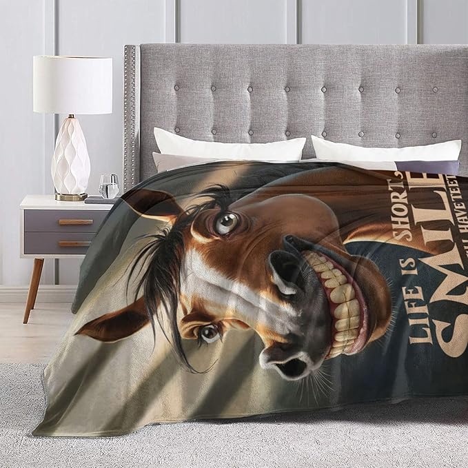 CozyNest Decor funny horse fleece throw blanket on sofa, soft and colorful, perfect for kids and adults, 60x50 inches.