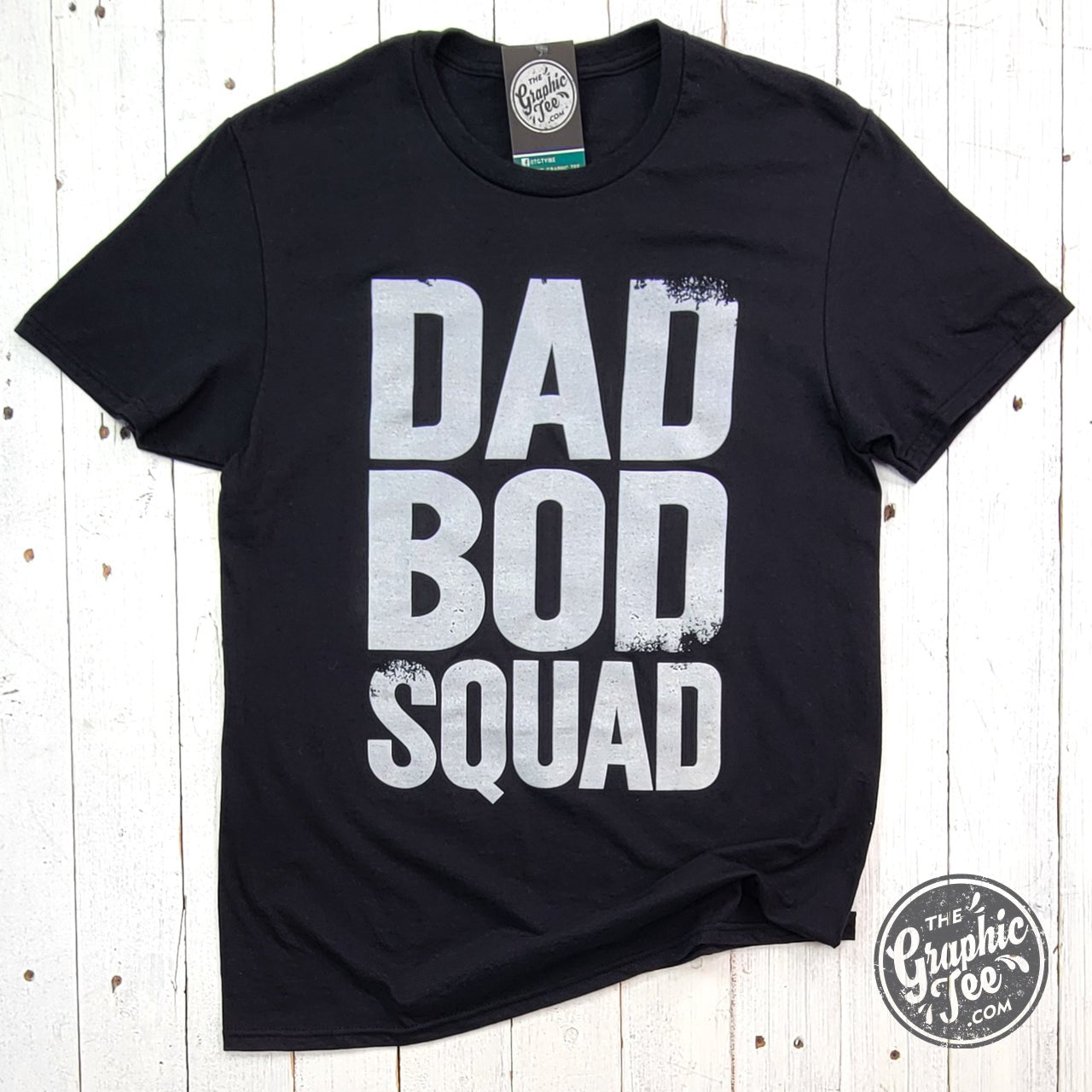 Black ink Dad Bod Squad graphic short sleeve tee by The Graphic Tee, showing a casual men's t-shirt with bold design.