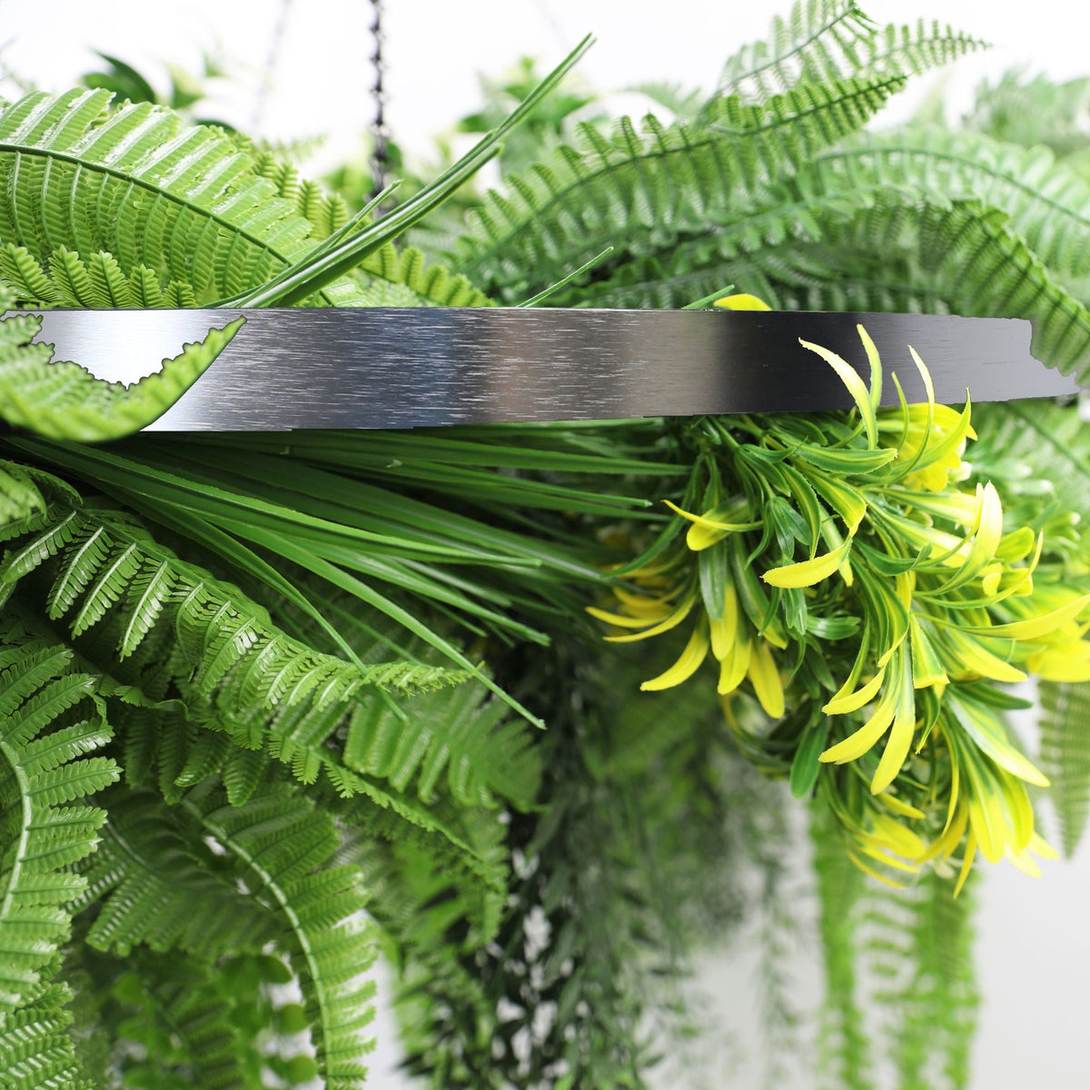 Artificial hanging fern chandelier with a silver circular frame, draping UV-resistant faux ferns and plants, 31.5 inches diameter.