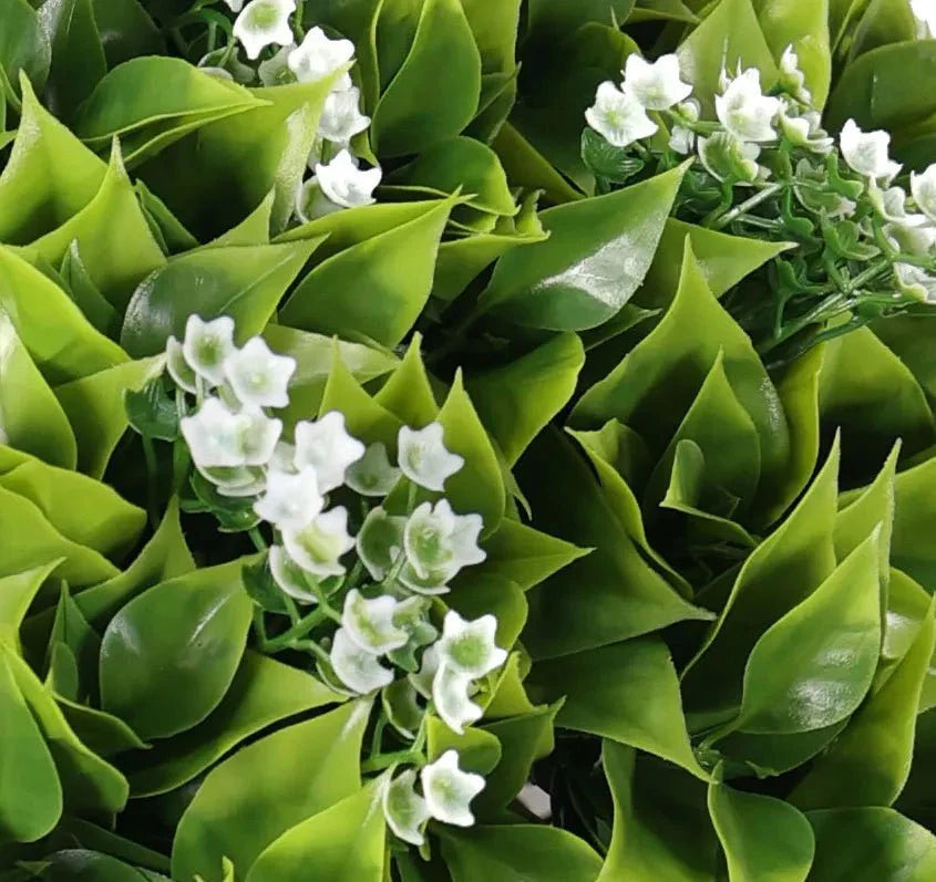 Close-up of Designer Plants USA wide leaf Buxus artificial flowering hanging basket with lush green leaves, UV resistant for outdoor use.