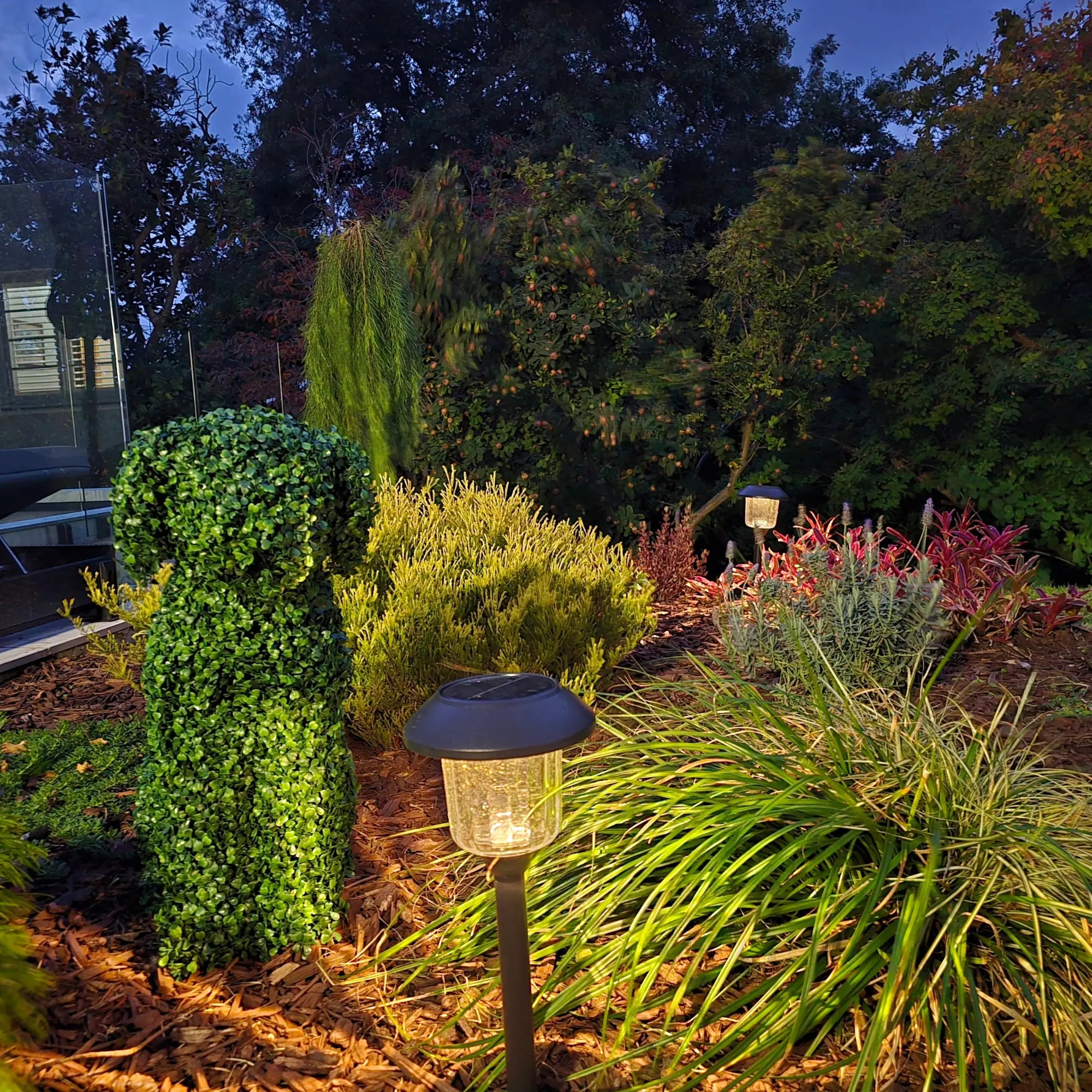 Artificial boxwood dog topiary from Designer Plants USA, 60cm UV-resistant topiary with garden lighting for indoor and outdoor decor.