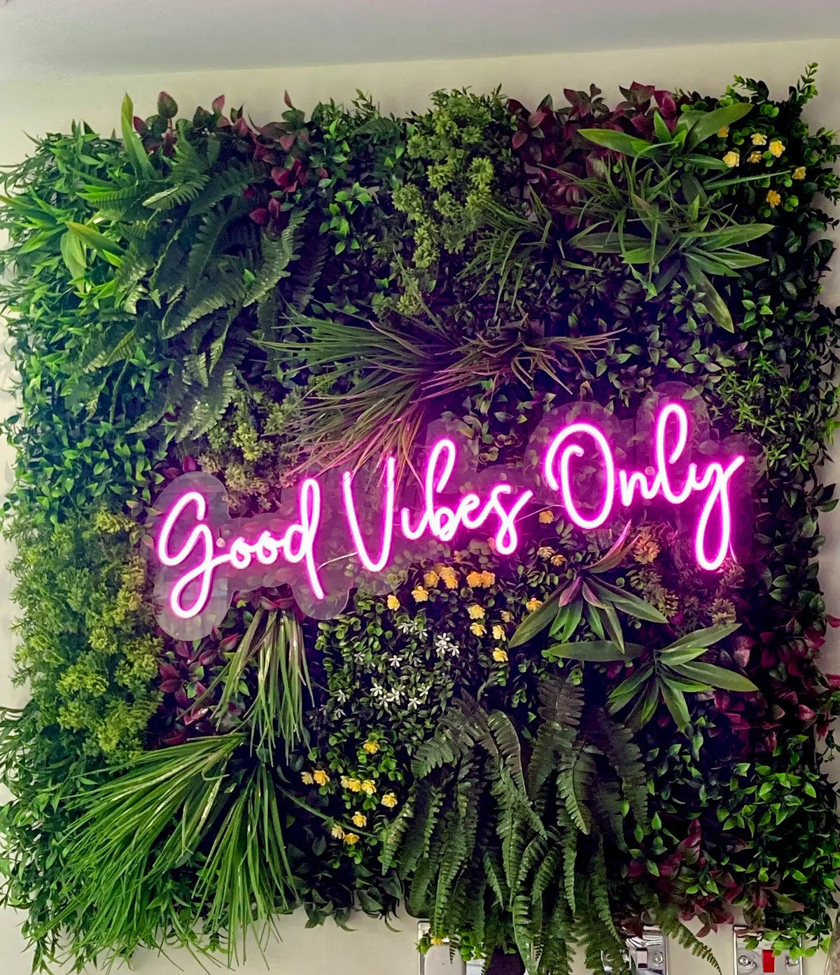 Artificial green wall panel by Designer Plants USA, 40x40 inches, UV resistant living wall for commercial spaces like salons.