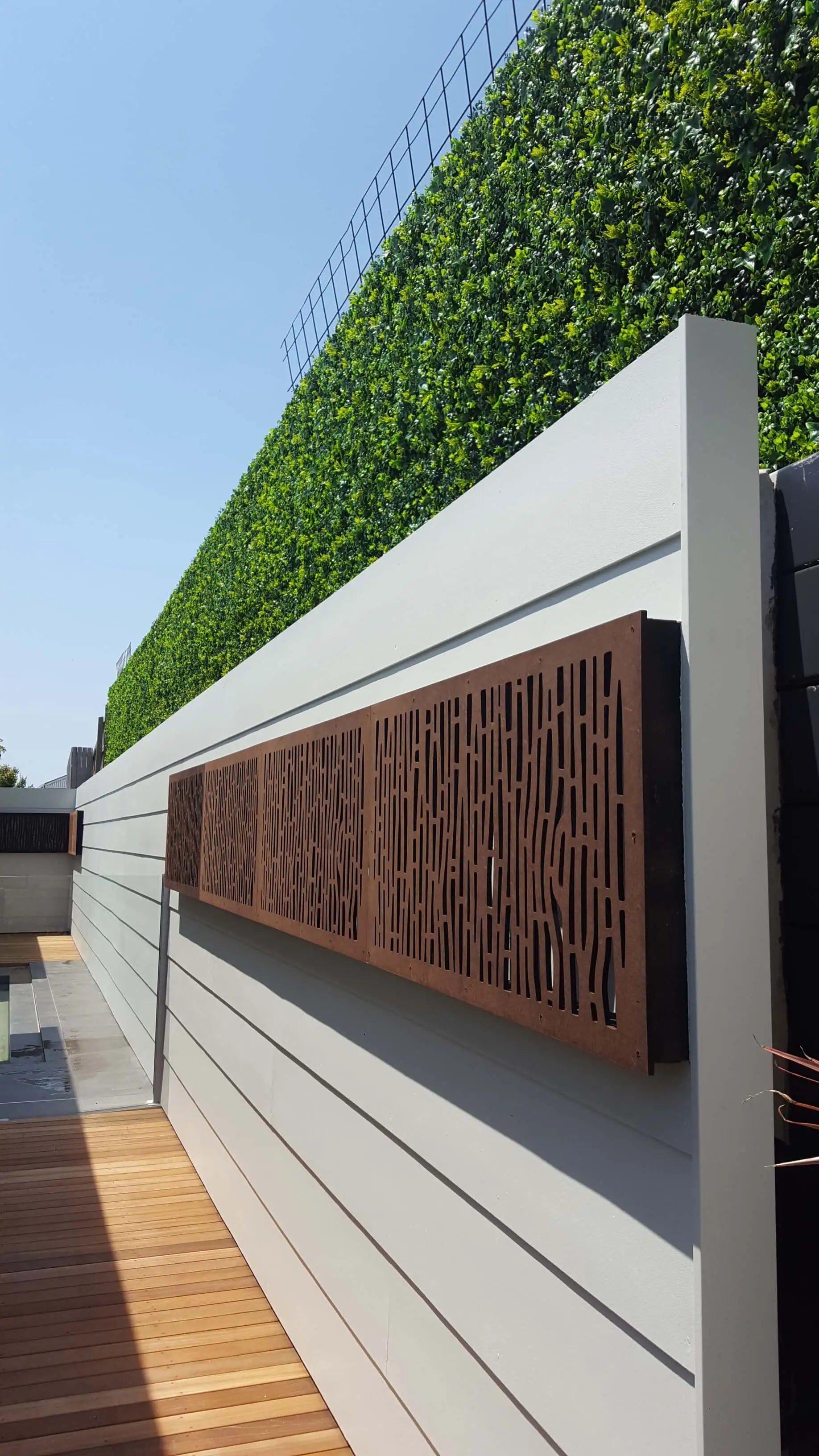 Artificial vertical garden panel by Designer Plants USA, green wall with lush, UV-resistant synthetic foliage for living walls.
