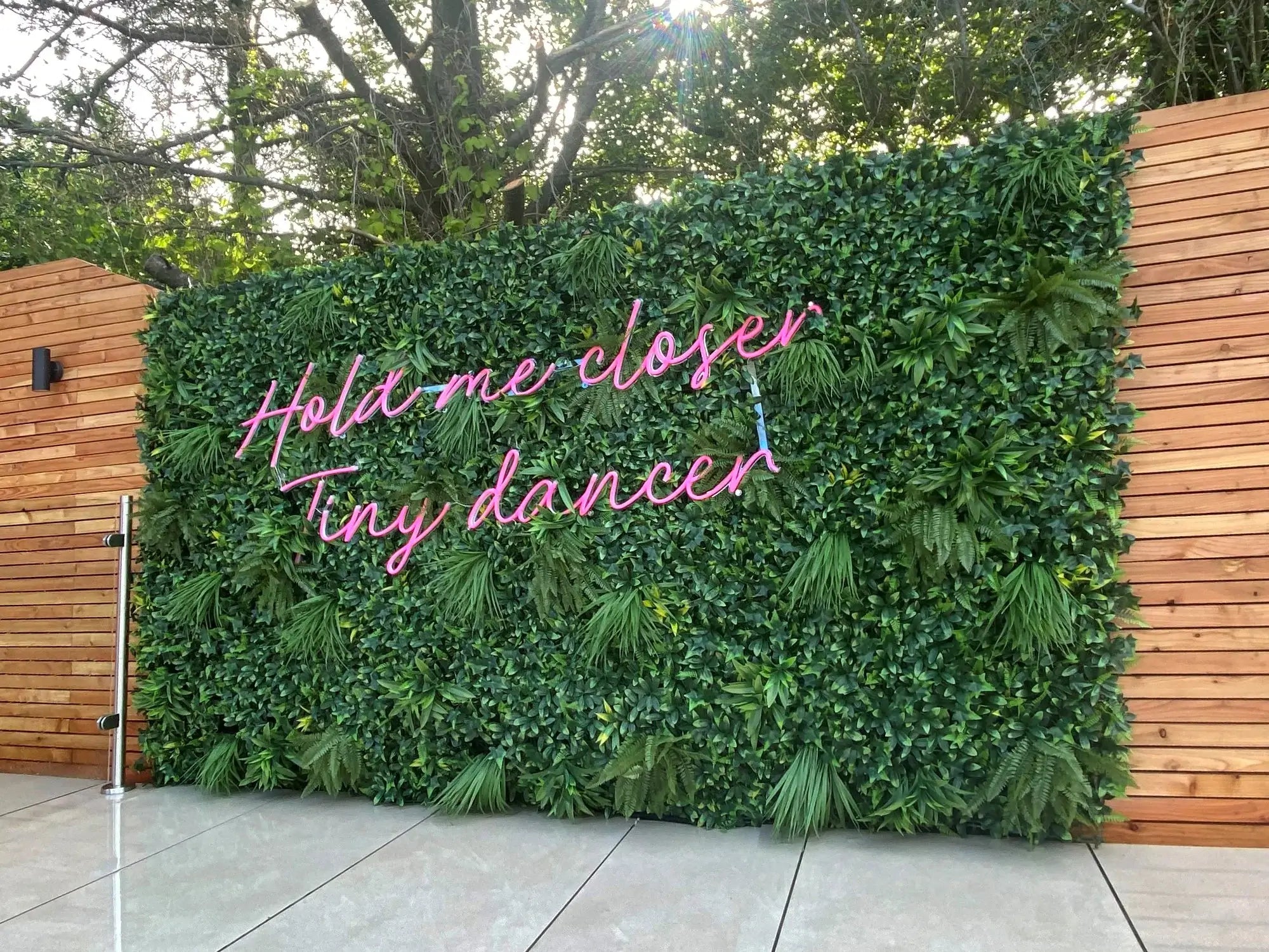 Small sample of Green Tropics vertical garden panel by Designer Plants USA, showing lush green outdoor plant wall for events.