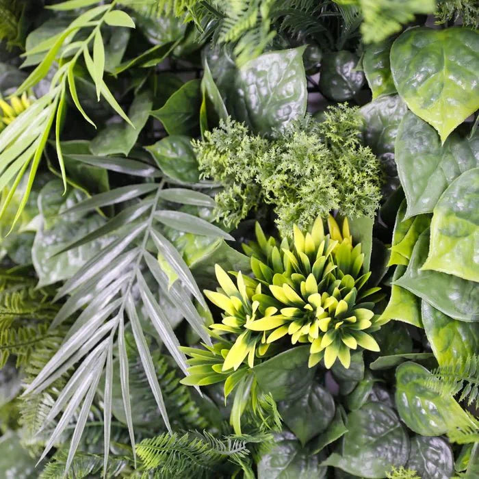 Close-up of Designer Plants USA Hawaiian Sunrise Flowering Vertical Garden sample panel with vibrant artificial palm leaf and colorful flowers.