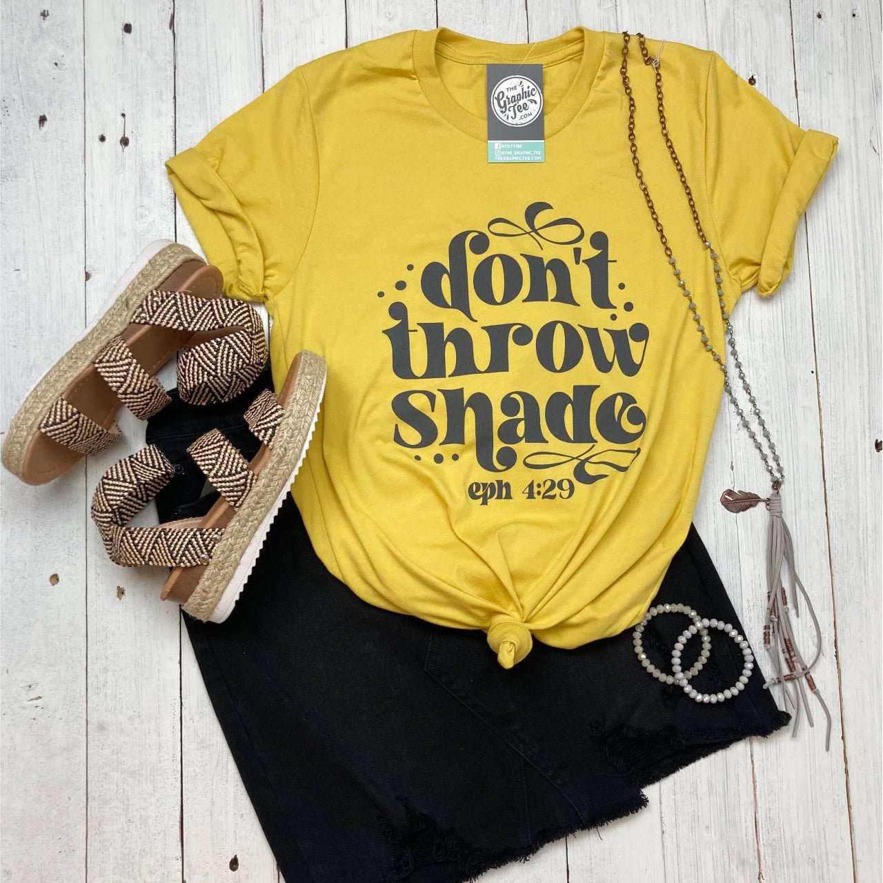 Maize yellow crew neck graphic tee from The Graphic Tee featuring a bold "Don't Throw Shade" design on short sleeves.