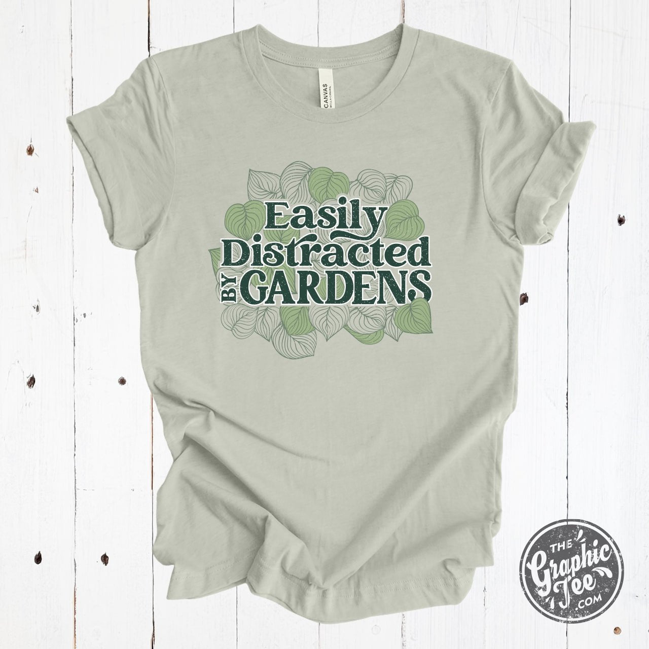 Easily Distracted By Gardens short sleeve graphic tee from The Graphic Tee, featuring a garden-themed design and casual fit.