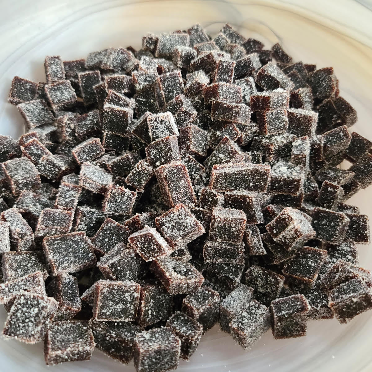 Elderberry Boost Gummies from Elderberry Boost, LLC, shown in a clear container with black elderberries and gummies visible.