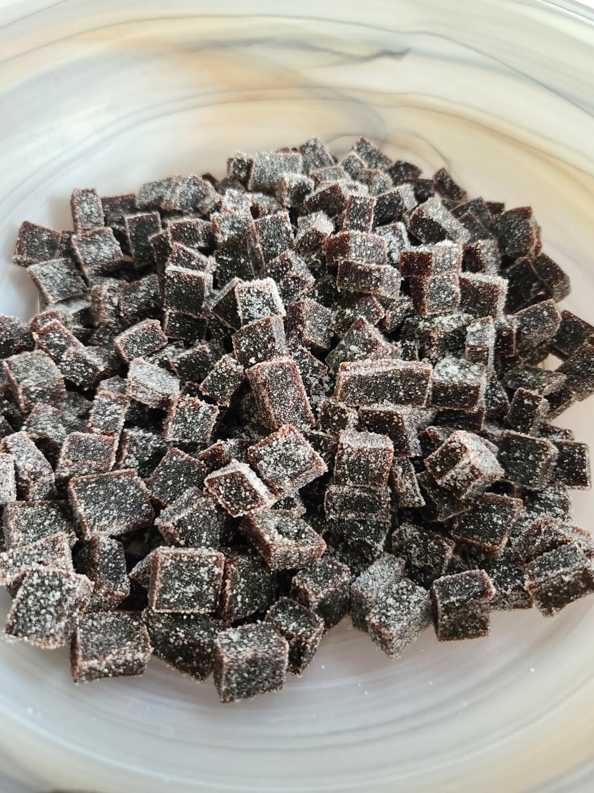 Elderberry Boost Gummies from Elderberry Boost, LLC, shown in a clear container with black elderberries and gummies visible.