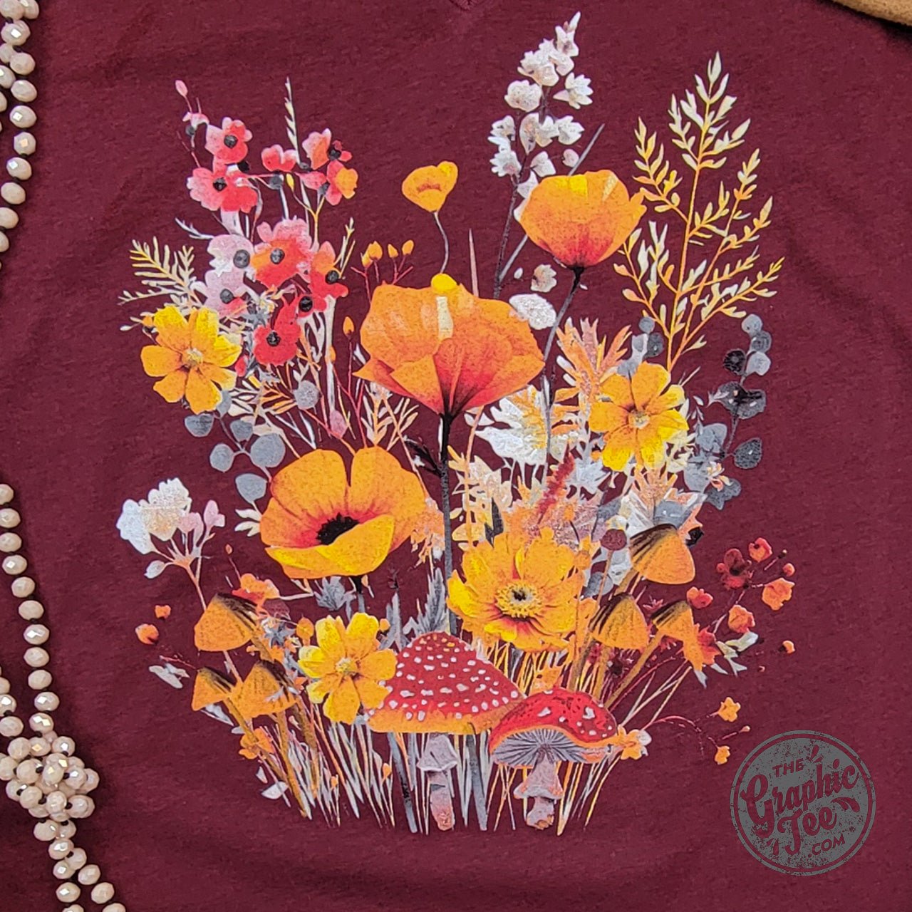 Fall Boho floral Heather Cardinal V-neck short sleeve graphic tee from The Graphic Tee, featuring a vibrant floral design and crew neck.