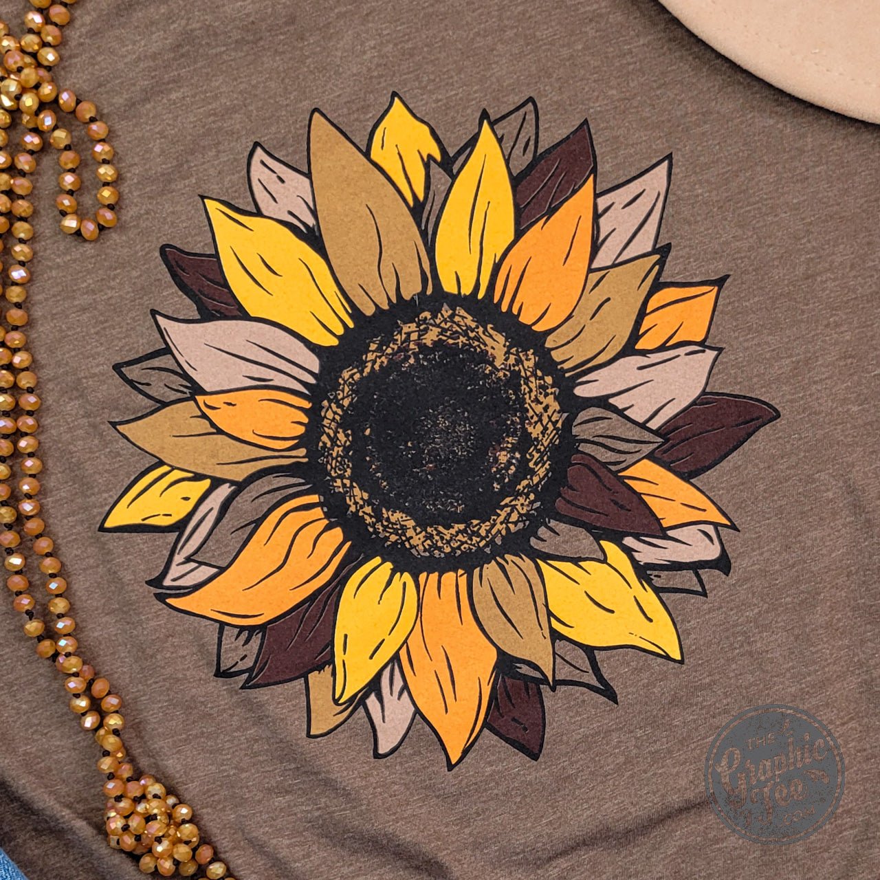 Fall Sunflower Heather Brown Short Sleeve Graphic Tee by The Graphic Tee featuring sunflower design on a cozy brown heather fabric.