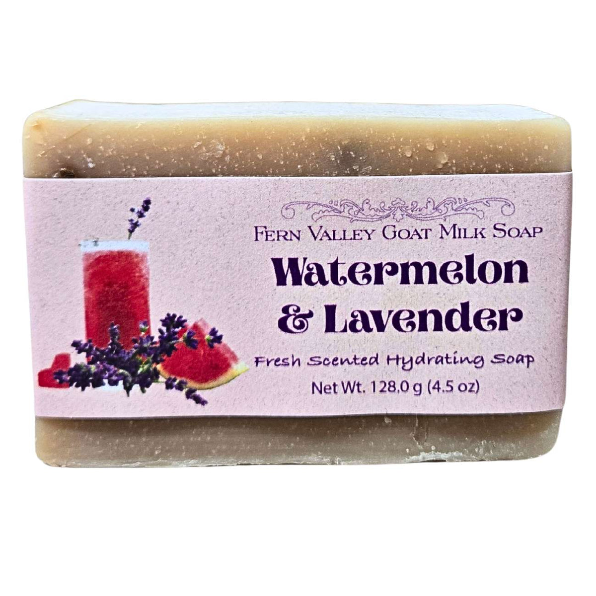Handmade goat milk soap bar with fresh watermelon and lavender scent from Fern Valley Soap, showcasing vibrant pink and purple swirls.