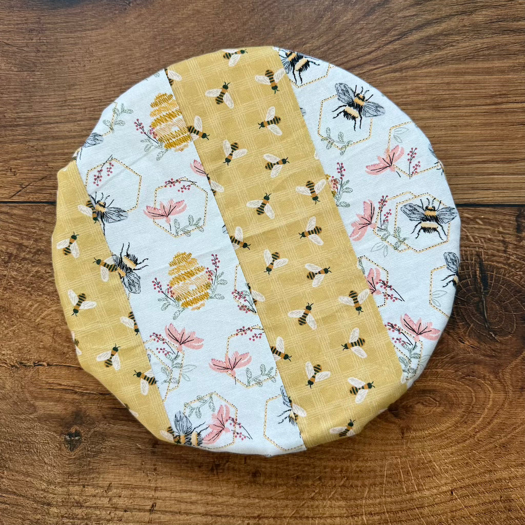 Small mushroom-shaped bowl and Banneton covers from Five Oaks Farm, rustic kitchen tools for bread baking and storage.