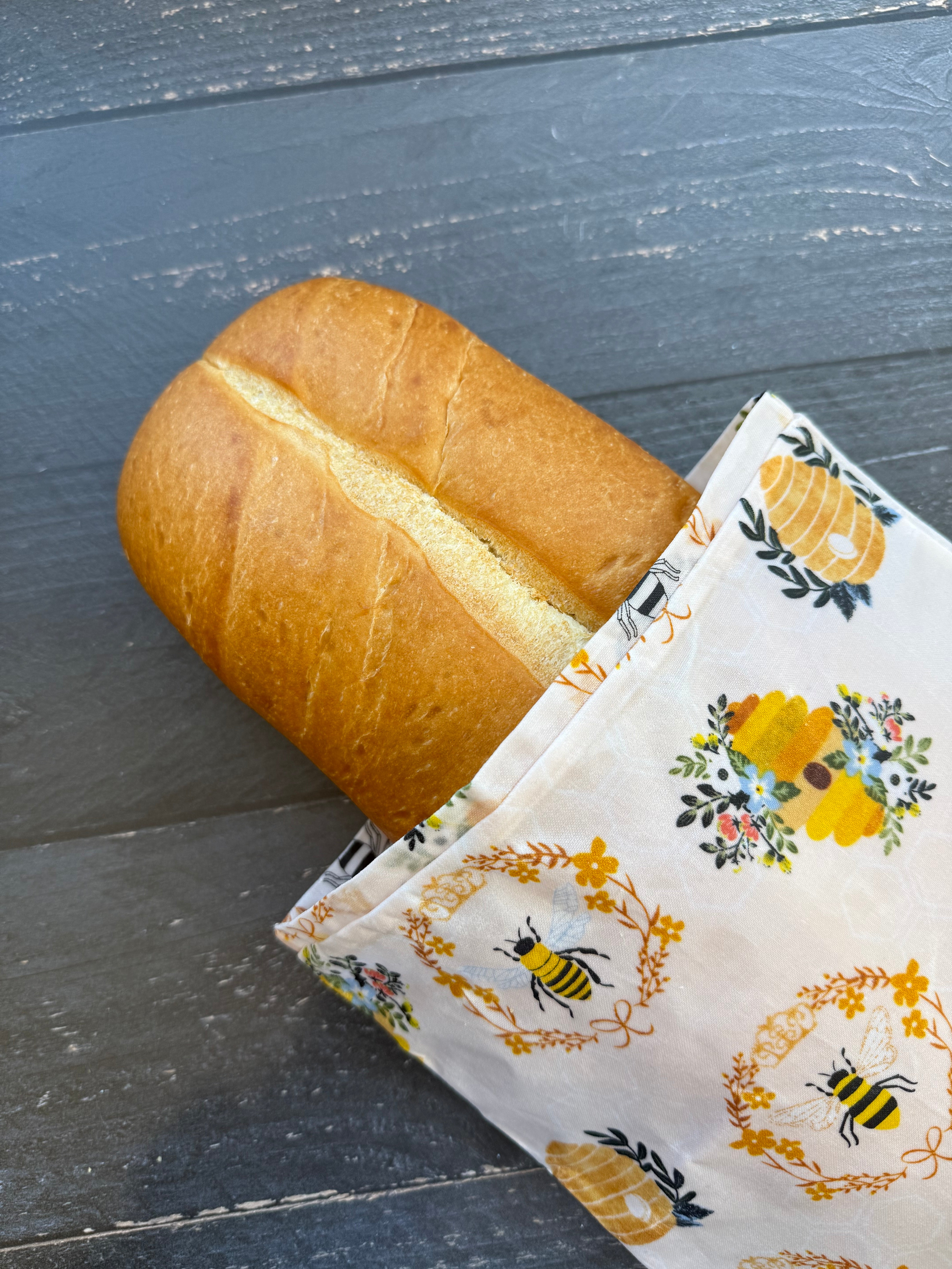Beeswaxed Baguette bag from Five Oaks Farm with floral design, crafted from natural beeswaxed material, ideal for farm-to-market use.