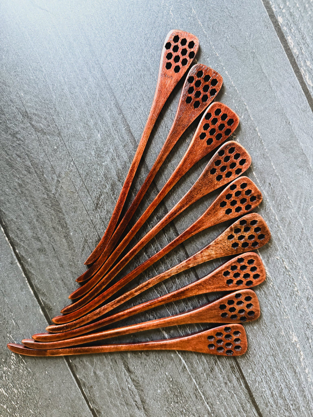 Honey spoon from Five Oaks Farm, natural wooden utensil for serving honey, with a smooth handle and rounded scoop.