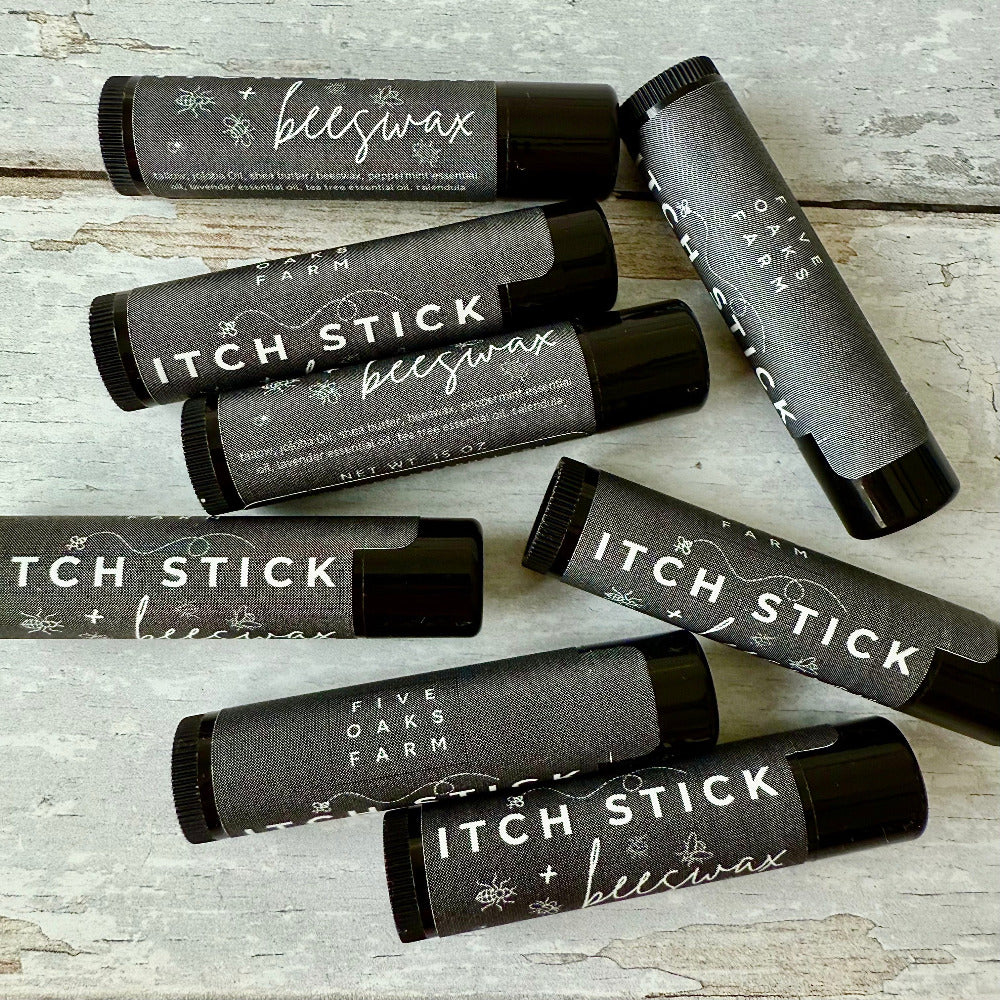 Five Oaks Farm Itch Stick from the Farm, natural remedy for skin irritation, shown in a close-up of the product tube.