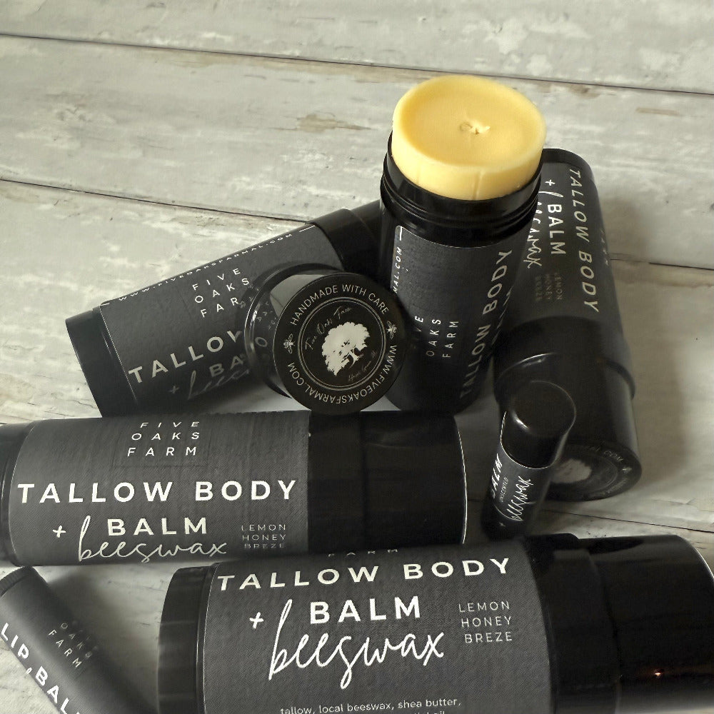 Two jars of Five Oaks Farm Tallow Body Balm from the farm, showing creamy texture and natural packaging.