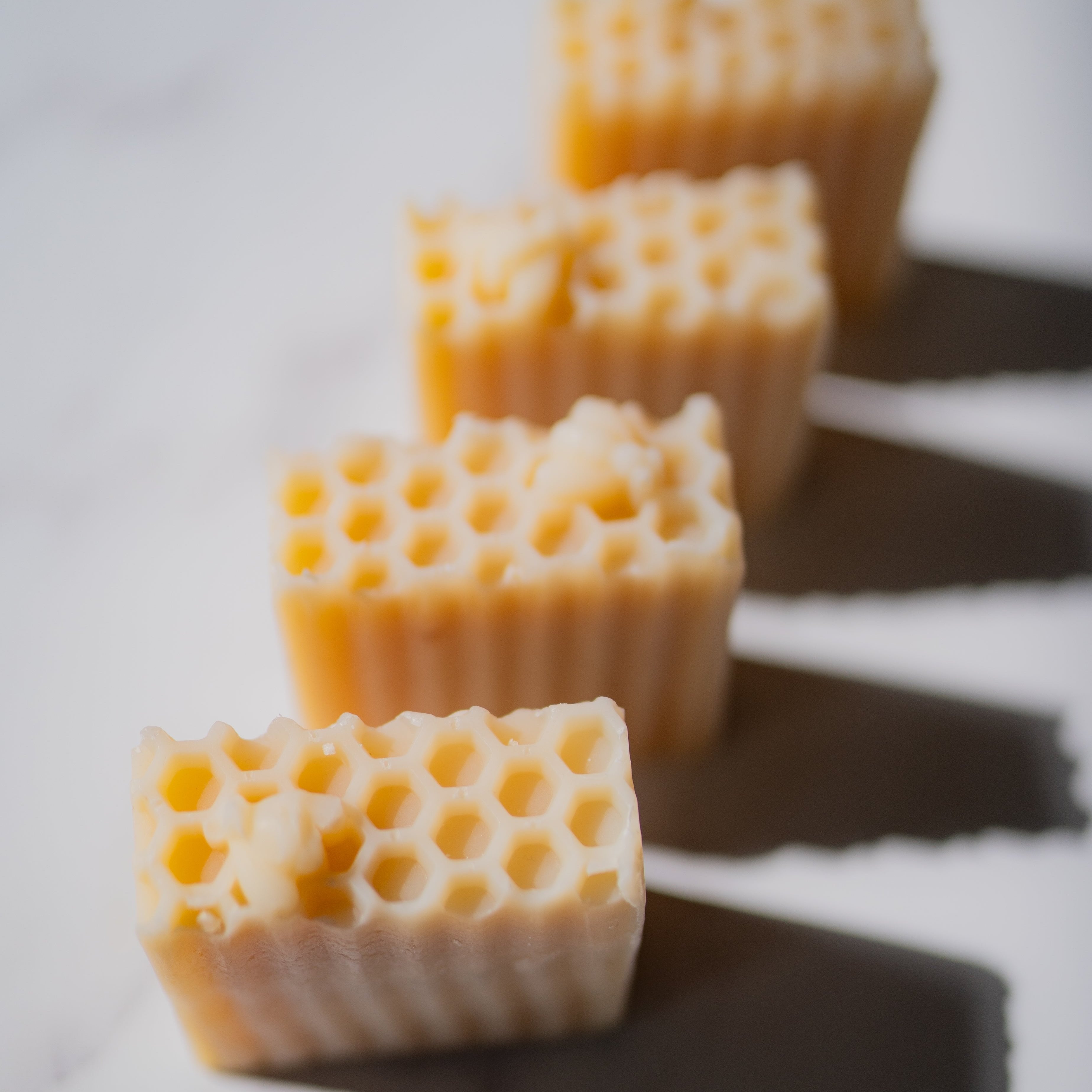 Handmade farm soap by Five Oaks Farm with lemon and honey scent, showing a rustic soap bar with natural ingredients.