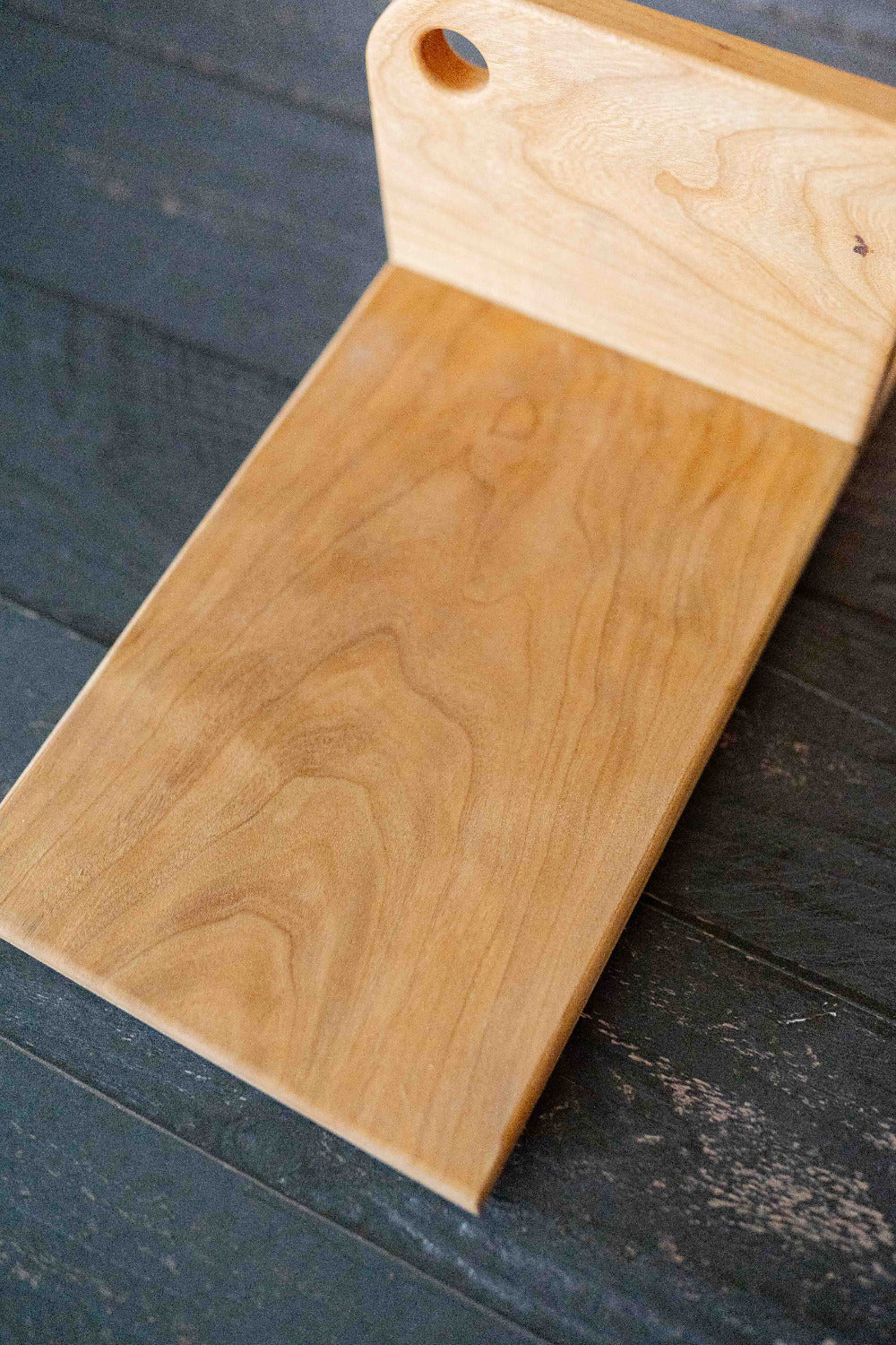Vertical maple cutting board from Five Oaks Farm, showcasing smooth surface and sturdy design for kitchen use.