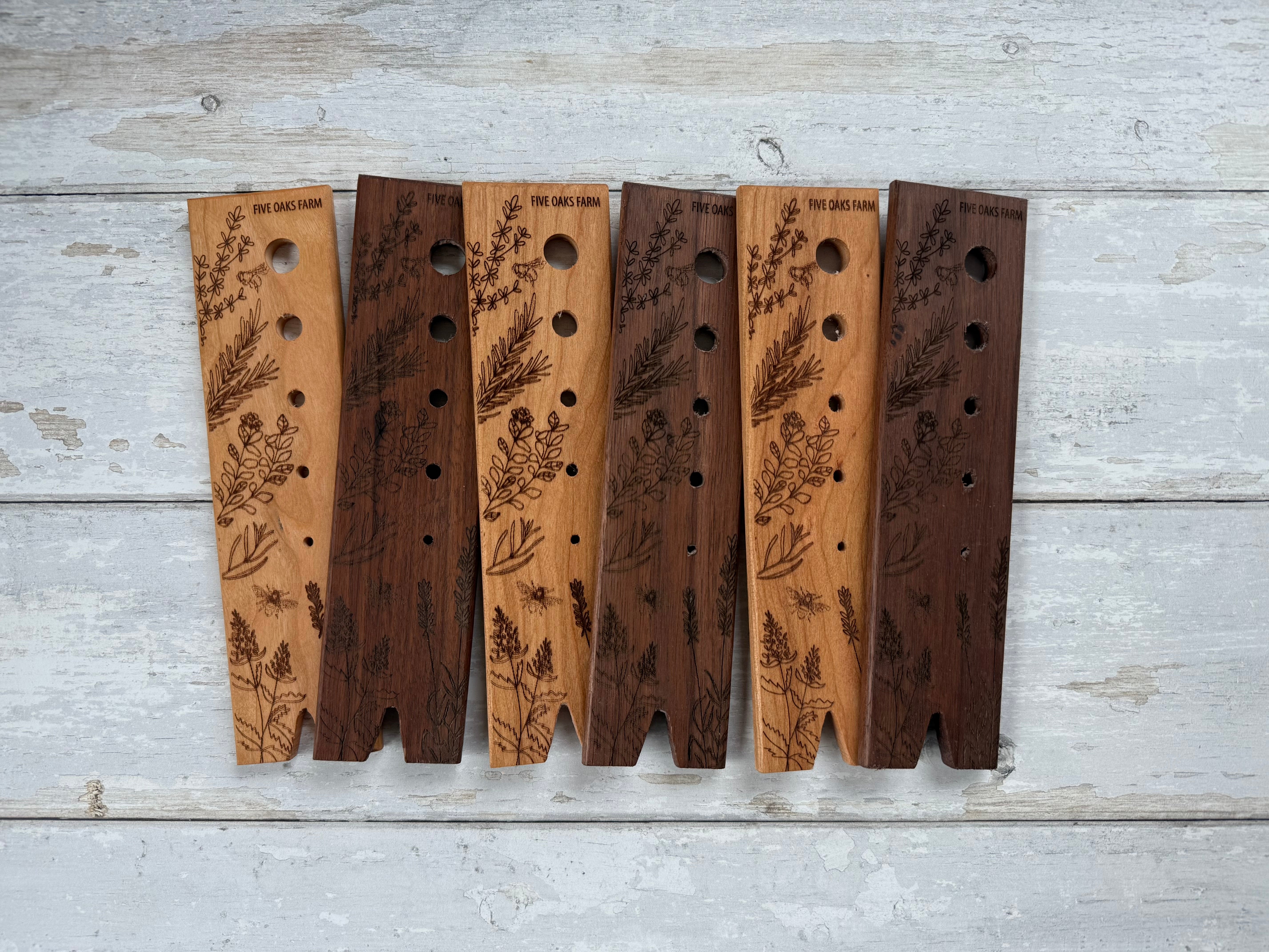 Five Oaks Farm walnut herb stripper with multiple stainless steel holes for quick herb leaf removal from stems.