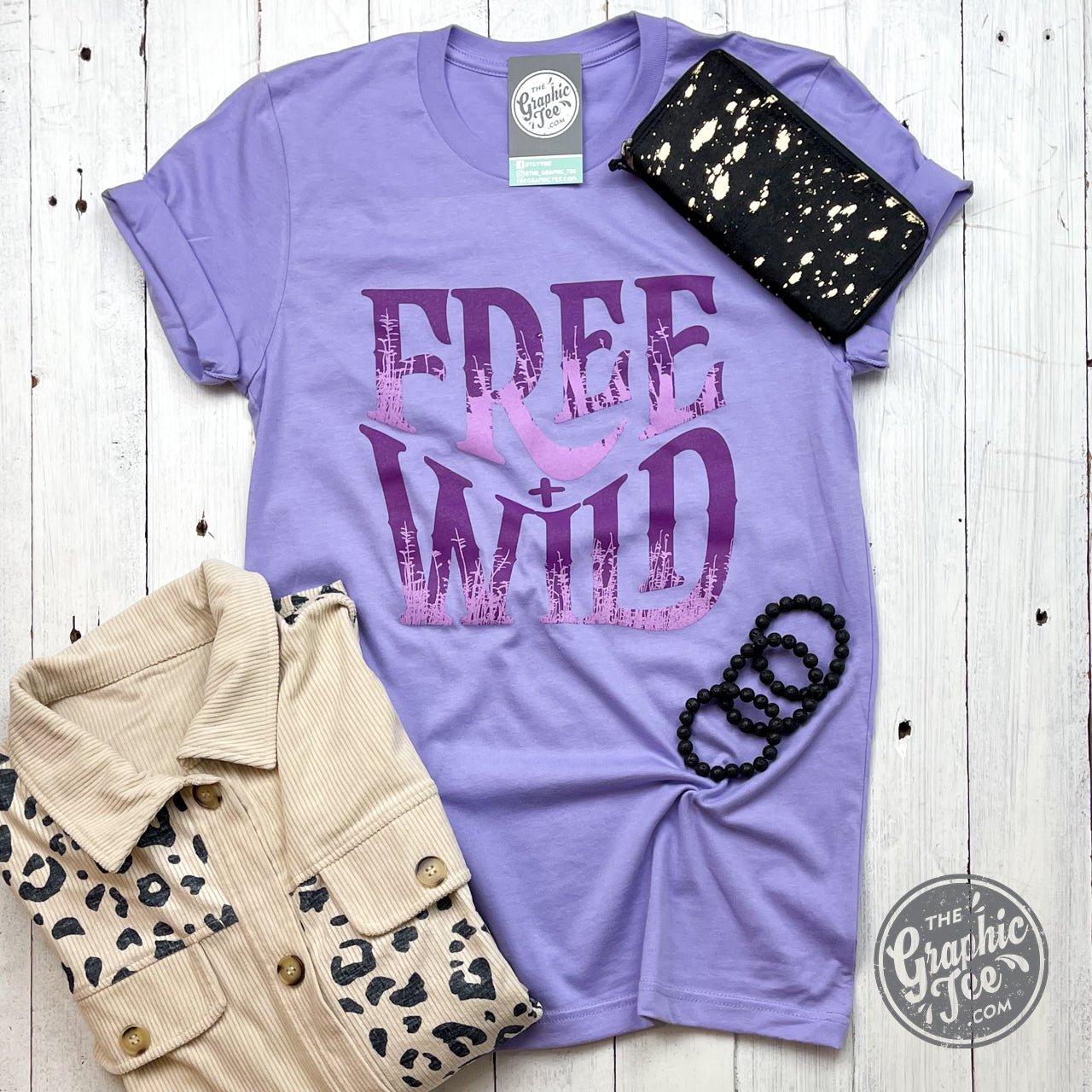 Dark lavender short sleeve crew neck graphic tee by Free + Wild, featuring a relaxed fit and casual style.