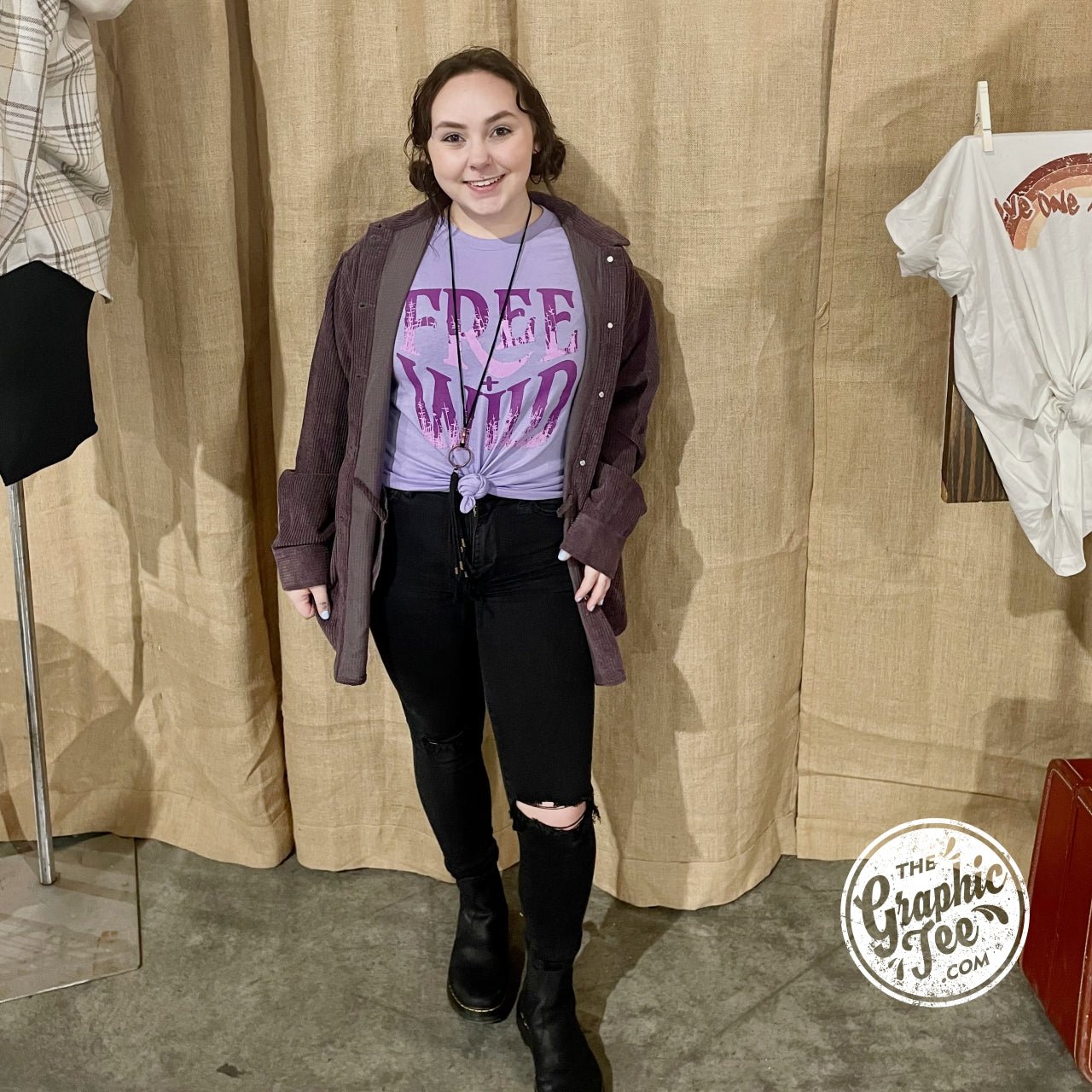 Dark lavender short sleeve crew neck graphic tee by Free + Wild, featuring a casual, stylish design on soft fabric.