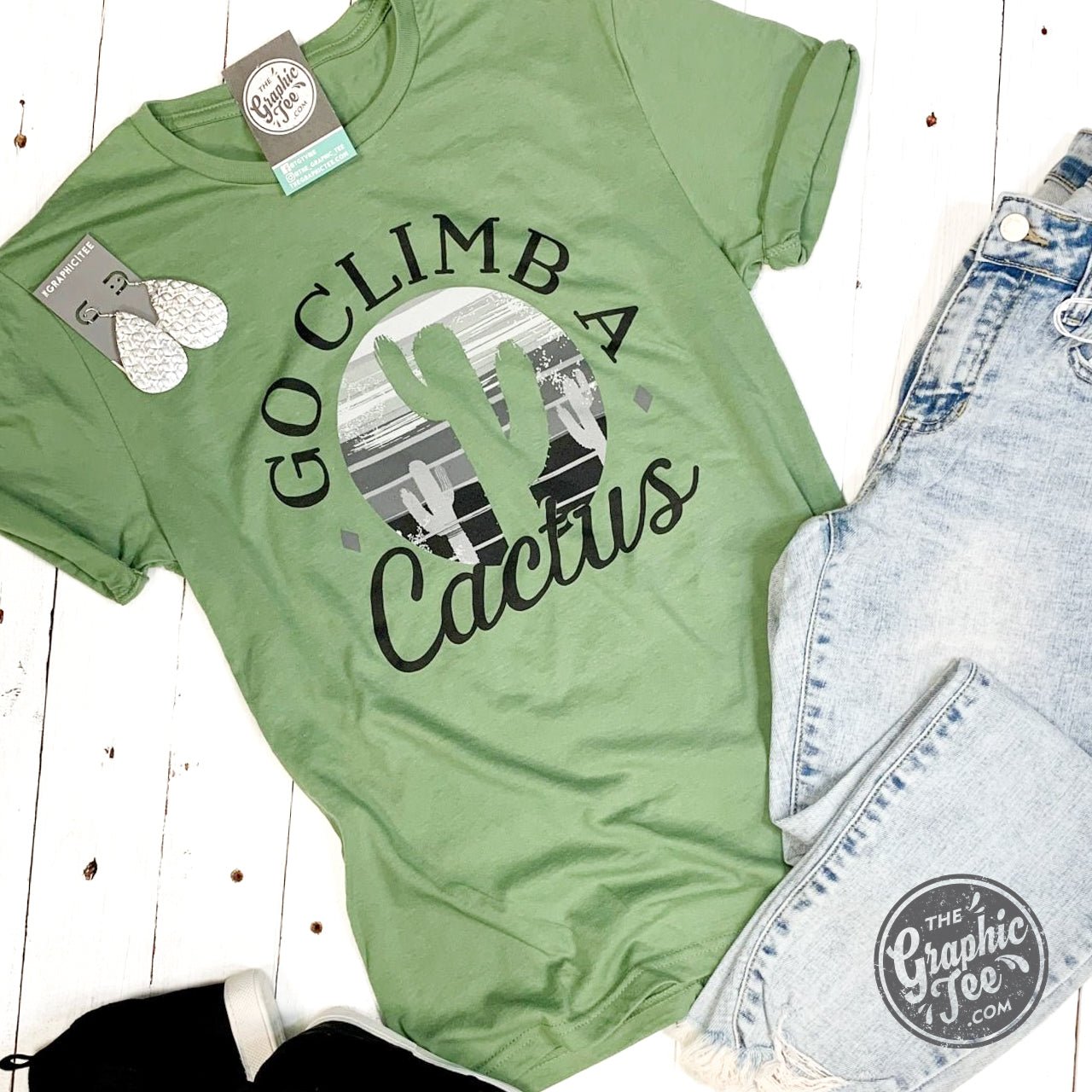 The Graphic Tee's Go Climb A Cactus SS Graphic T-shirt featuring a cactus design on soft, casual fabric.