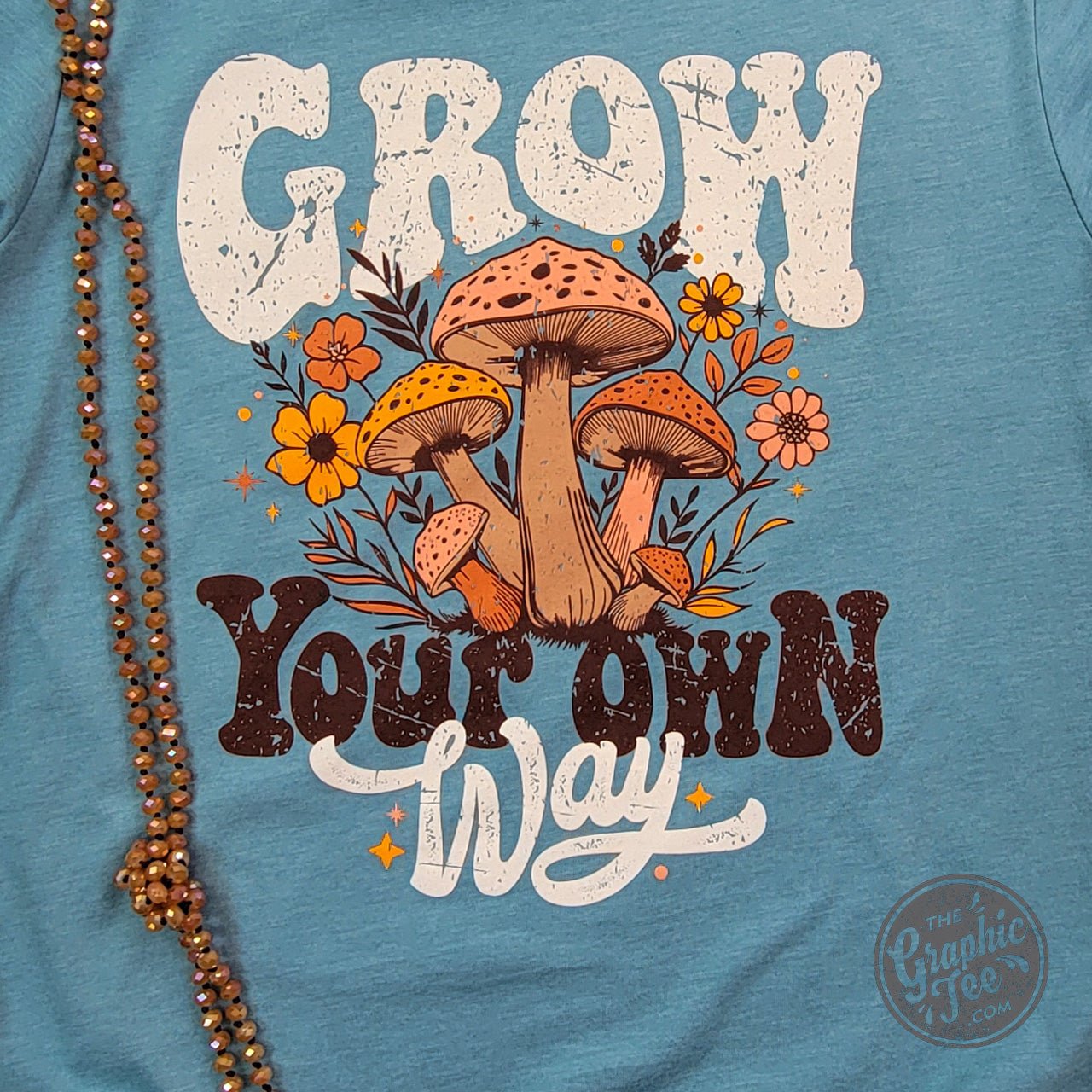 Heather blue Lagoon short sleeve graphic tee by The Graphic Tee featuring a stylish, casual design on soft fabric.