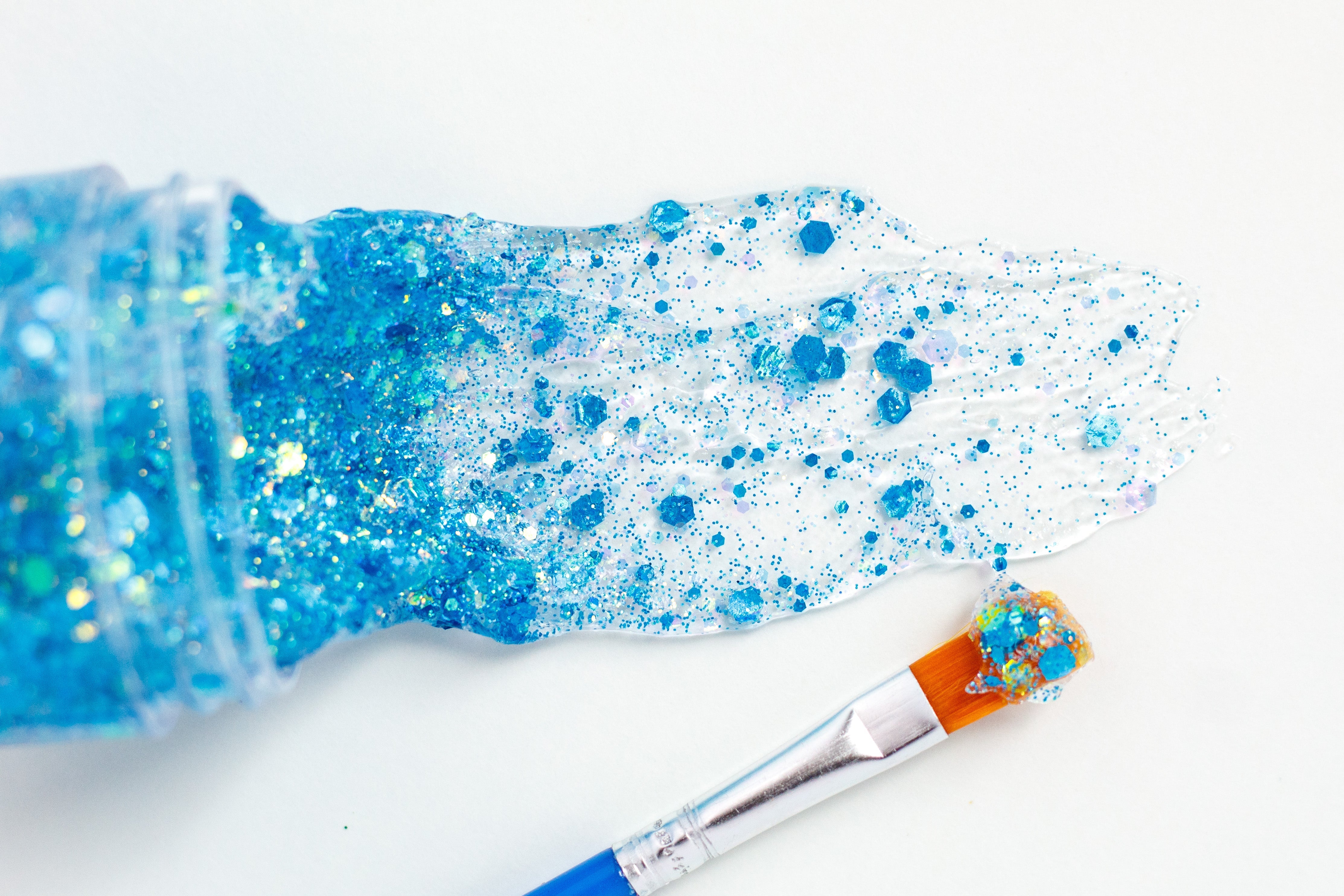 Blue hair glitter headband by Gussy Up Bow Co., featuring sparkling glitter design with a comfortable headband fit.