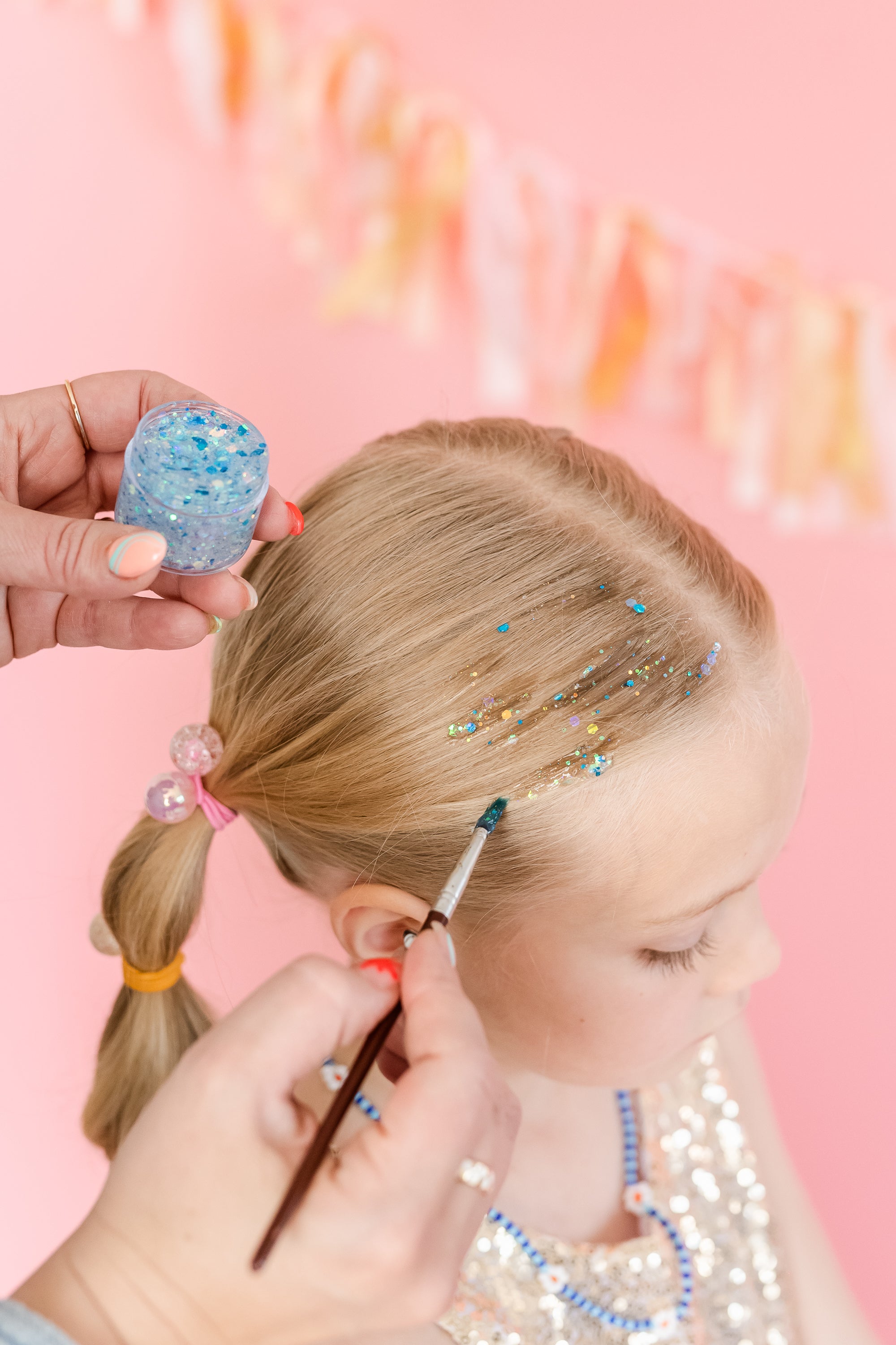 Blue hair glitter headband by Gussy Up Bow Co. featuring shimmering, sparkly design for festive or stylish wear.