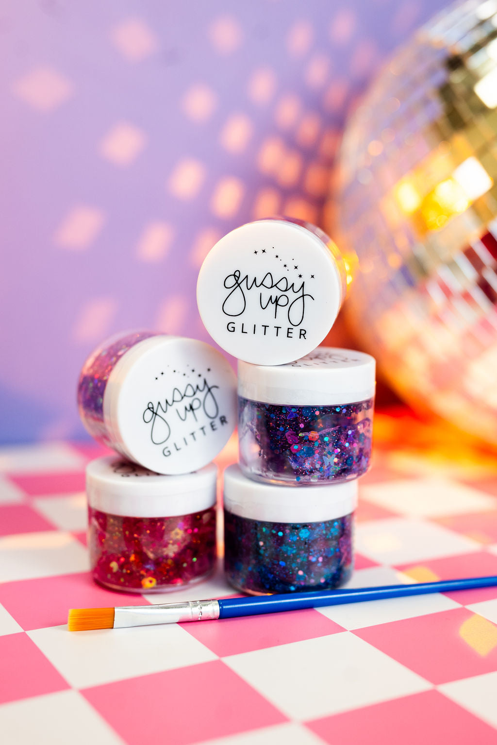 Gussy Up Bow Co. Mermaid Hair Glitter headbands with shimmering mermaid-themed embellishments on a fabric band.