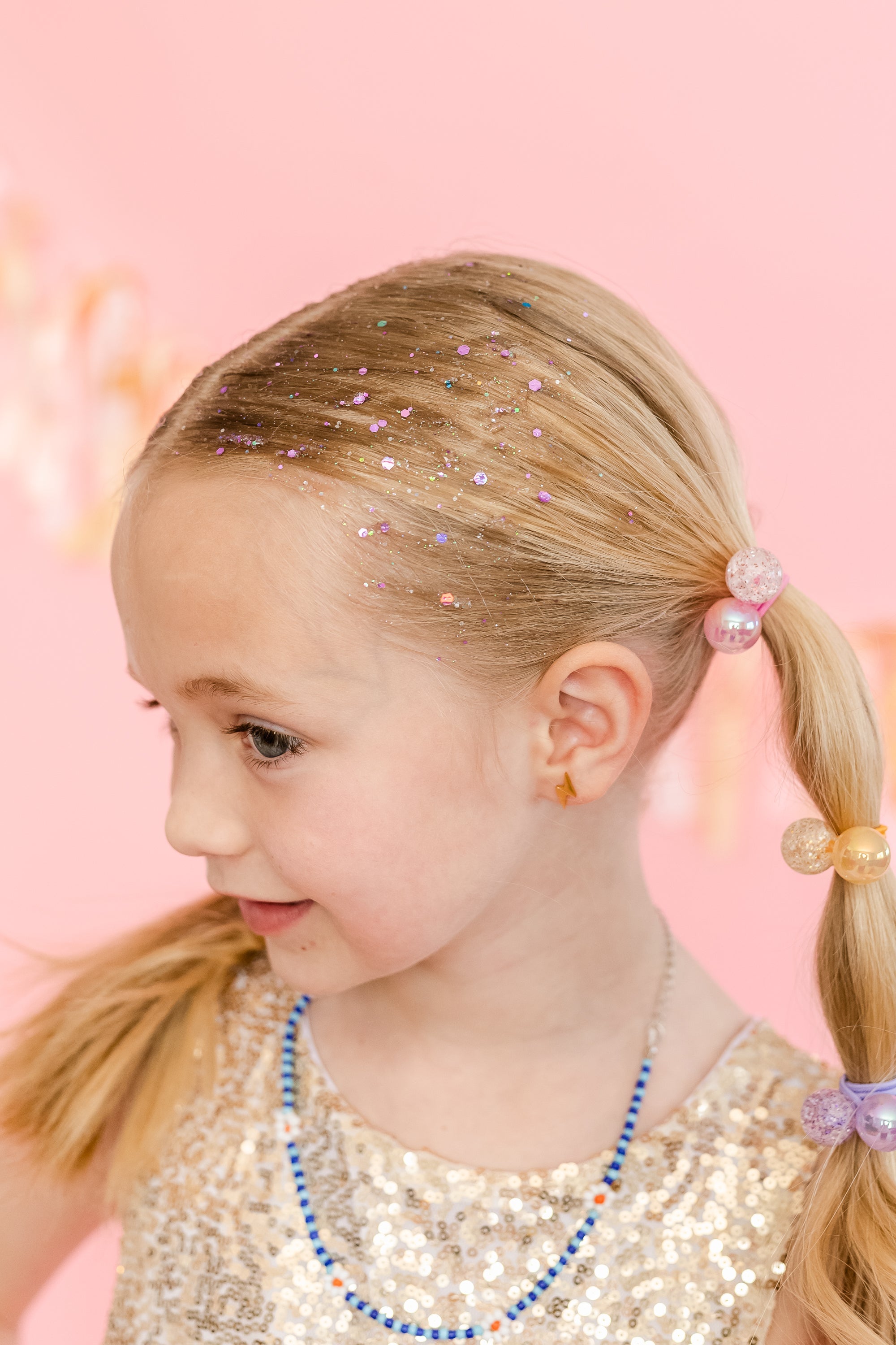 Purple hair glitter headband from Gussy Up Bow Co. featuring sparkling glitter and comfortable elastic band for stylish wear.