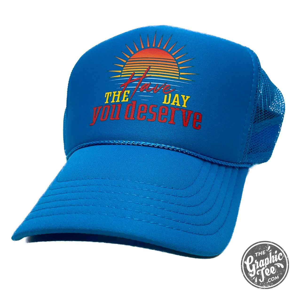 Foam trucker cap from The Graphic Tee with bold "Have the Day You Deserve" slogan, adjustable strap and mesh back.
