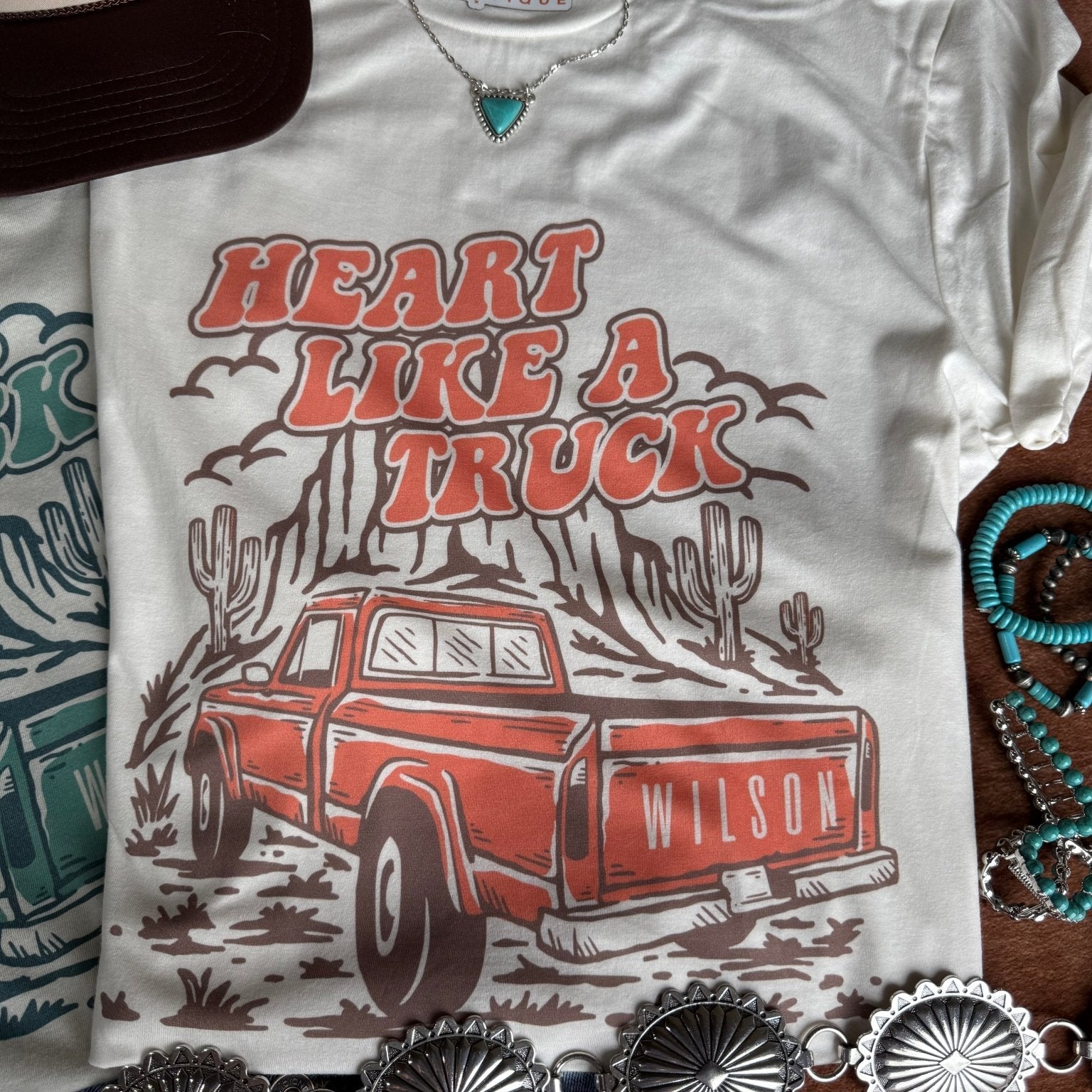Coral Heart Like A Truck graphic tee by Wild Junkie featuring a truck-shaped heart design on soft cotton fabric.