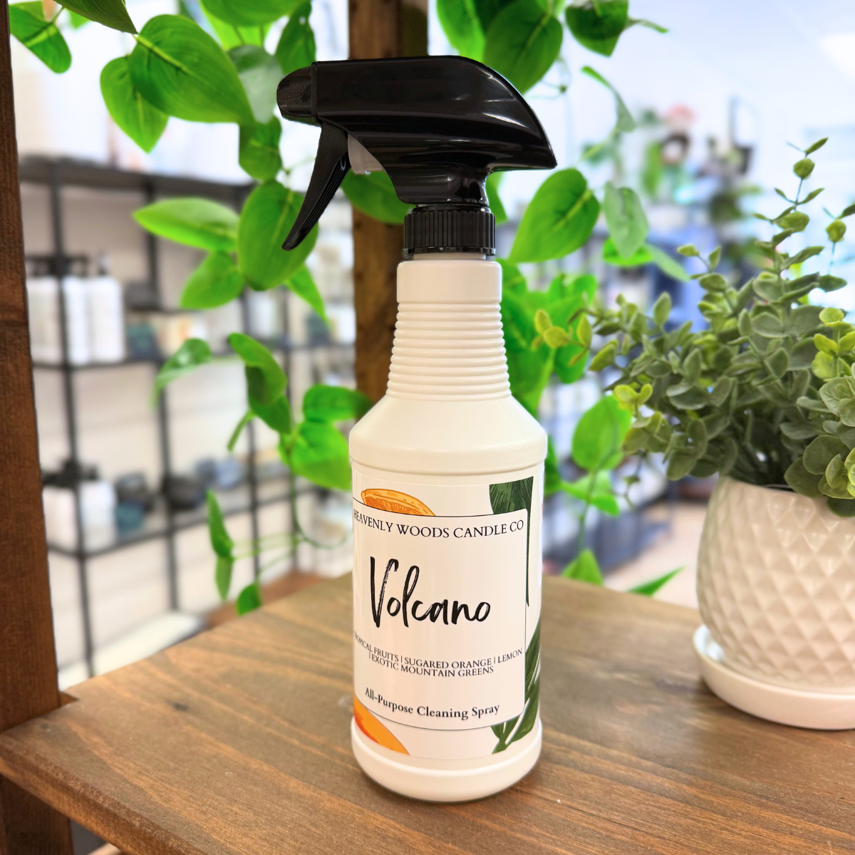 Volcano All-Purpose Cleaning Spray by Heavenly Woods Candle Co in a clear spray bottle with a label featuring volcanic imagery.