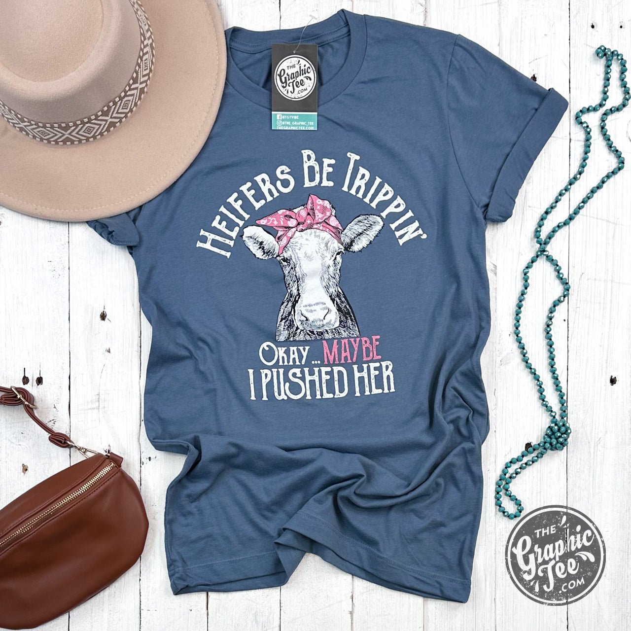 Heifers Be Trippin' slate short sleeve graphic tee by The Graphic Tee, featuring bold printed design on lightweight cotton shirt