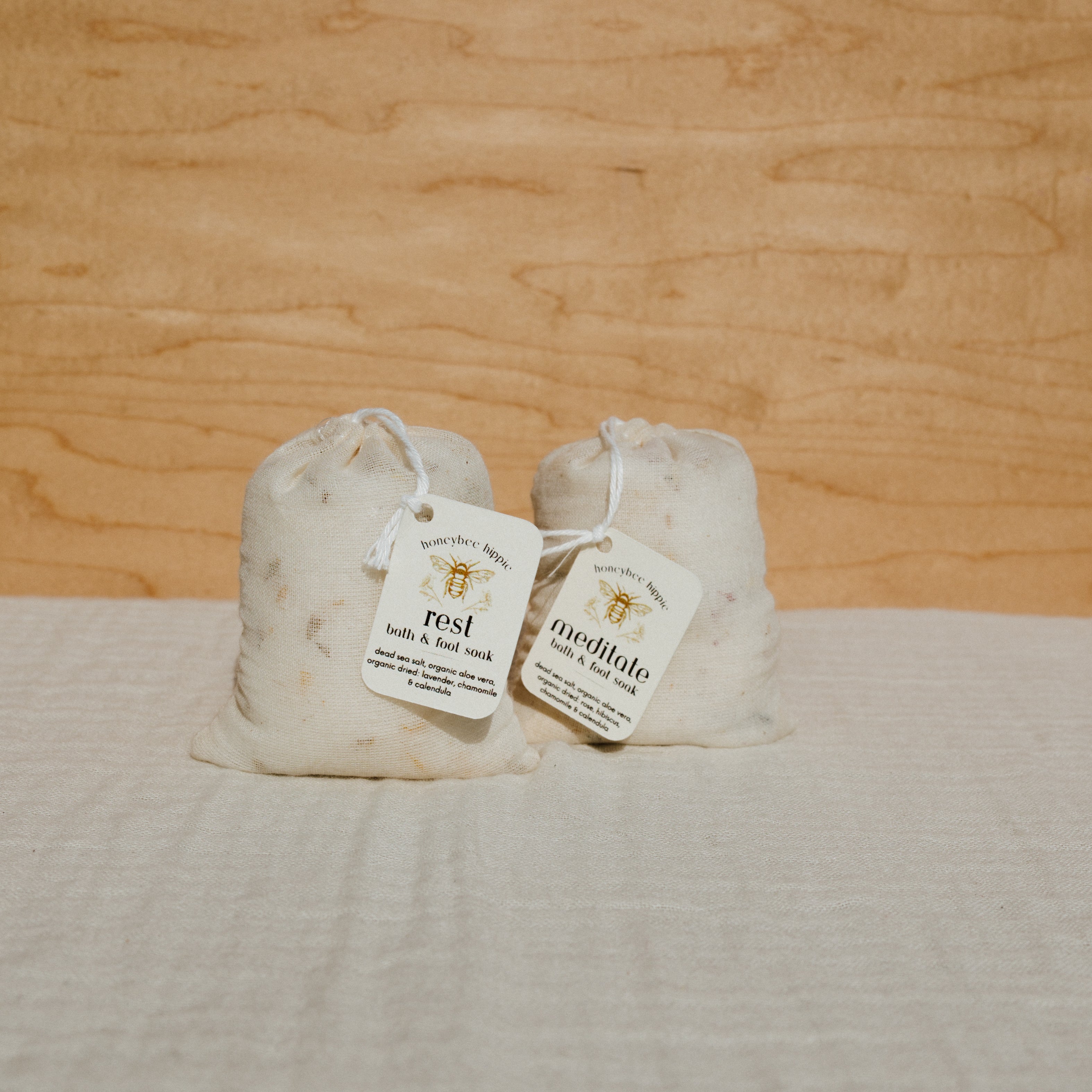 Honeybee Hippie rest bath soak in a cotton bag, natural bath salt for relaxing and soothing bath experiences.