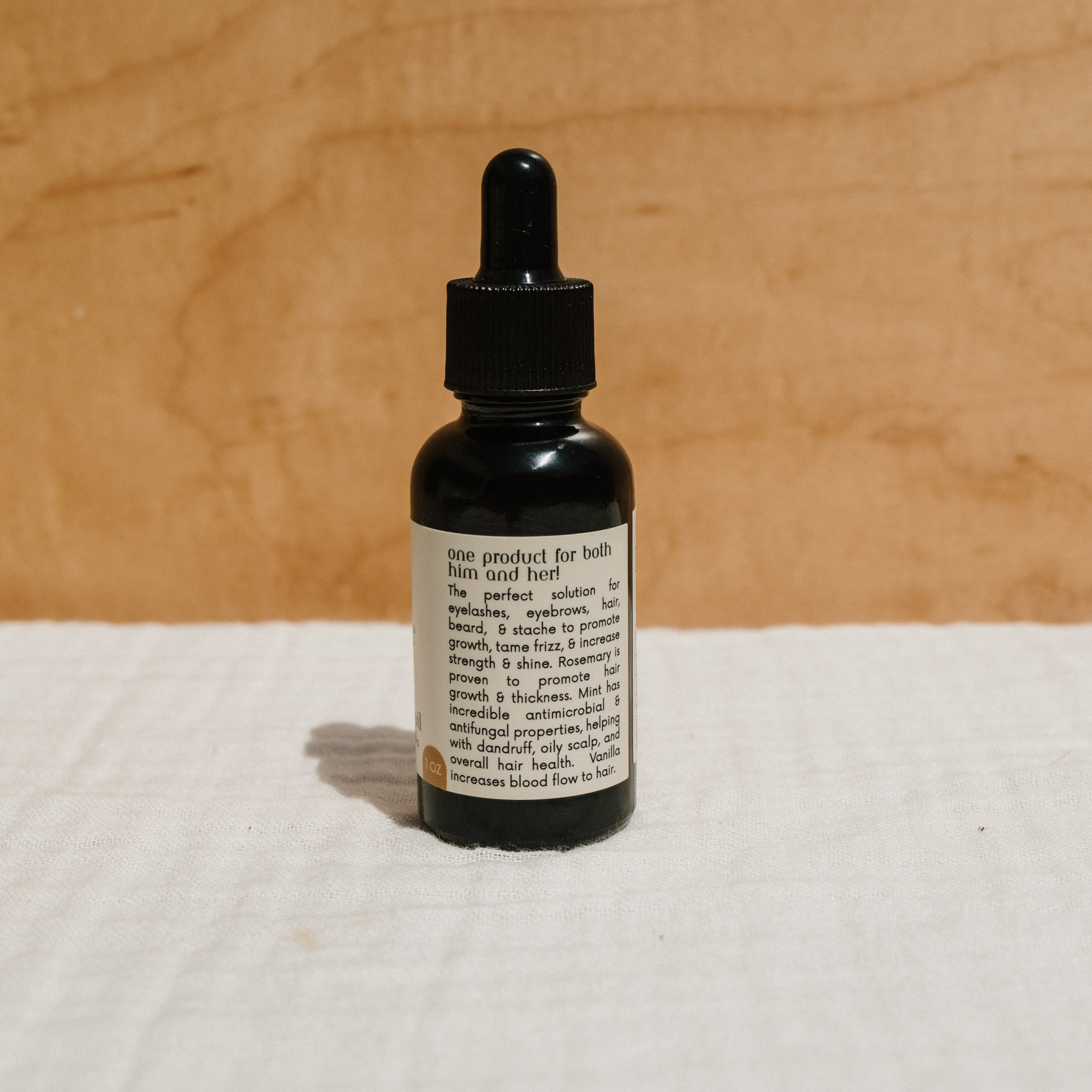 Honeybee Hippie hair and beard oil bottle showcasing natural hair and beard care for healthy, shiny hair and facial hair.