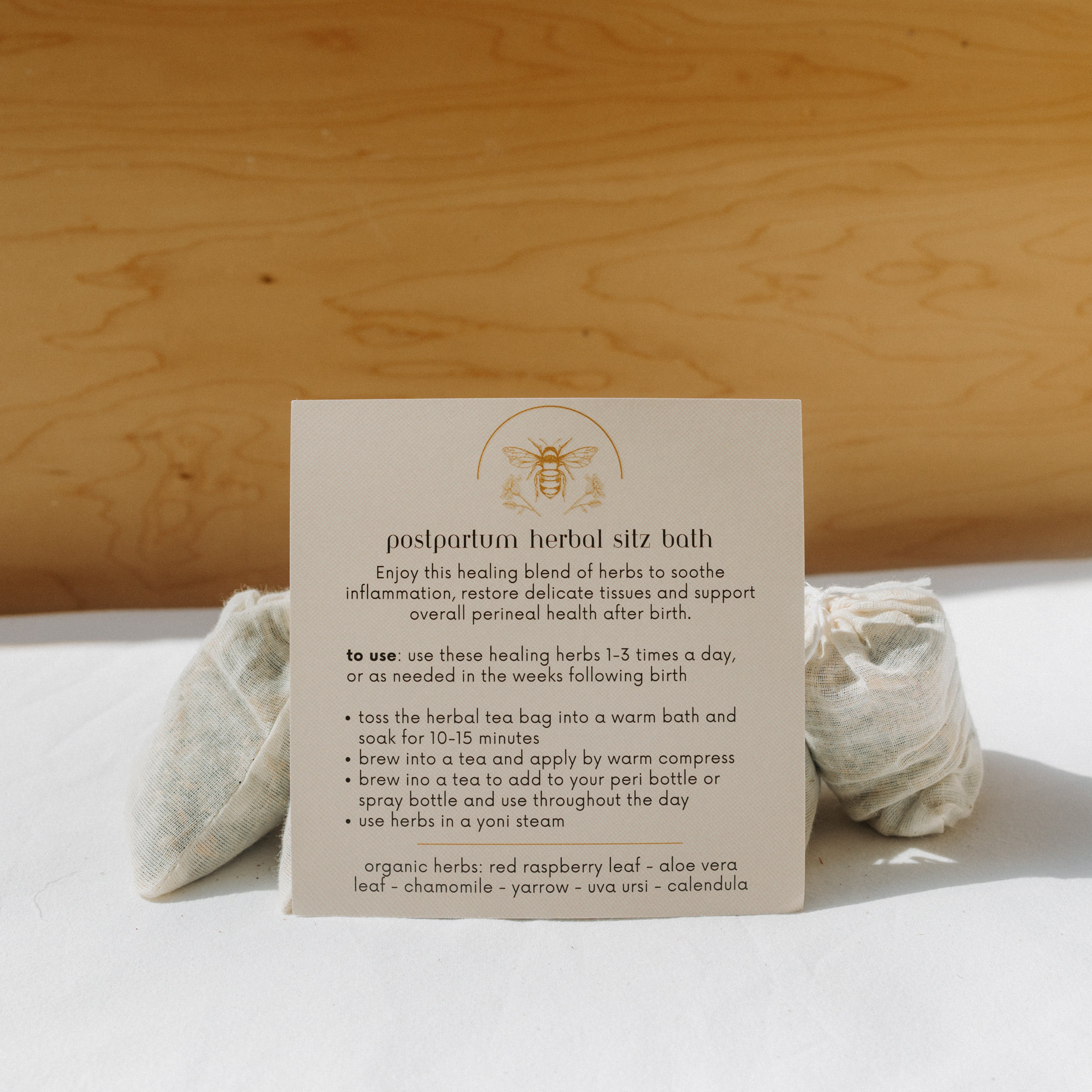 Herbal sitz bath by Honeybee Hippie designed for postpartum recovery, featuring natural herbs in a calming sitz bath setup.